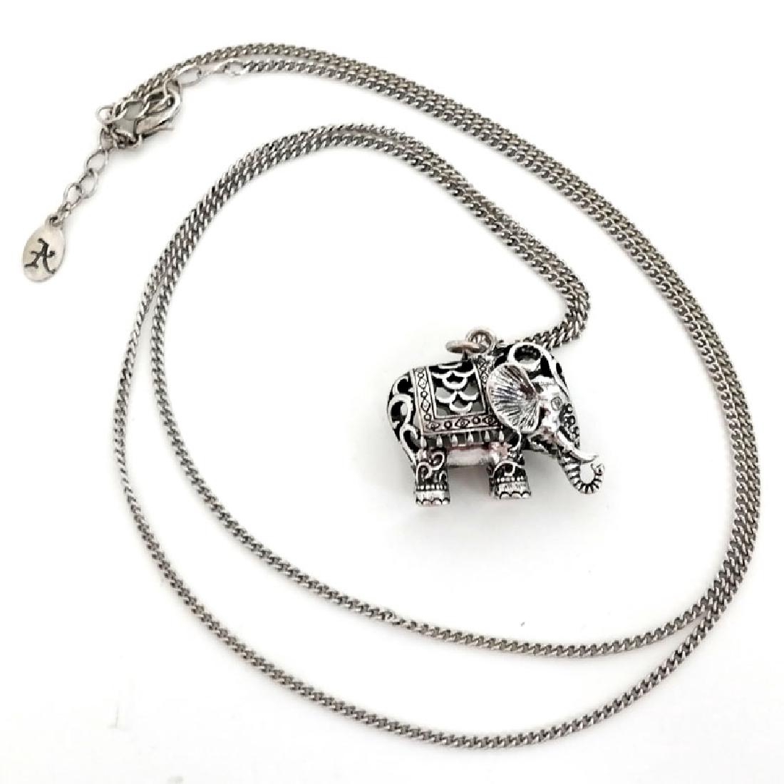 Silver tone Cuban link long chain with puffy ELEPHANT: Silver tone Cuban link long chain with puffy ELEPHANT shaped pendant. Length of chain 32" plus 2" extension. Pendant measured 1 1/4" x 1" x 1/2". Condition very good.