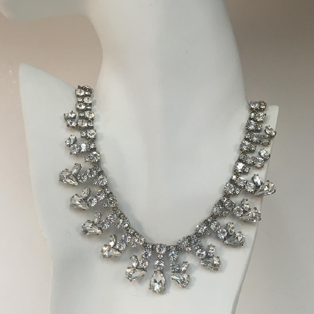 Antique color metal with white prongs set round (1 of 3)