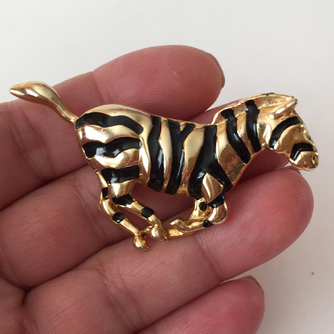 Gold plated ZEBRA shaped brooch with black enamel: Gold plated ZEBRA shaped brooch with black enamel. Length 2 3/8". Condition excellent.