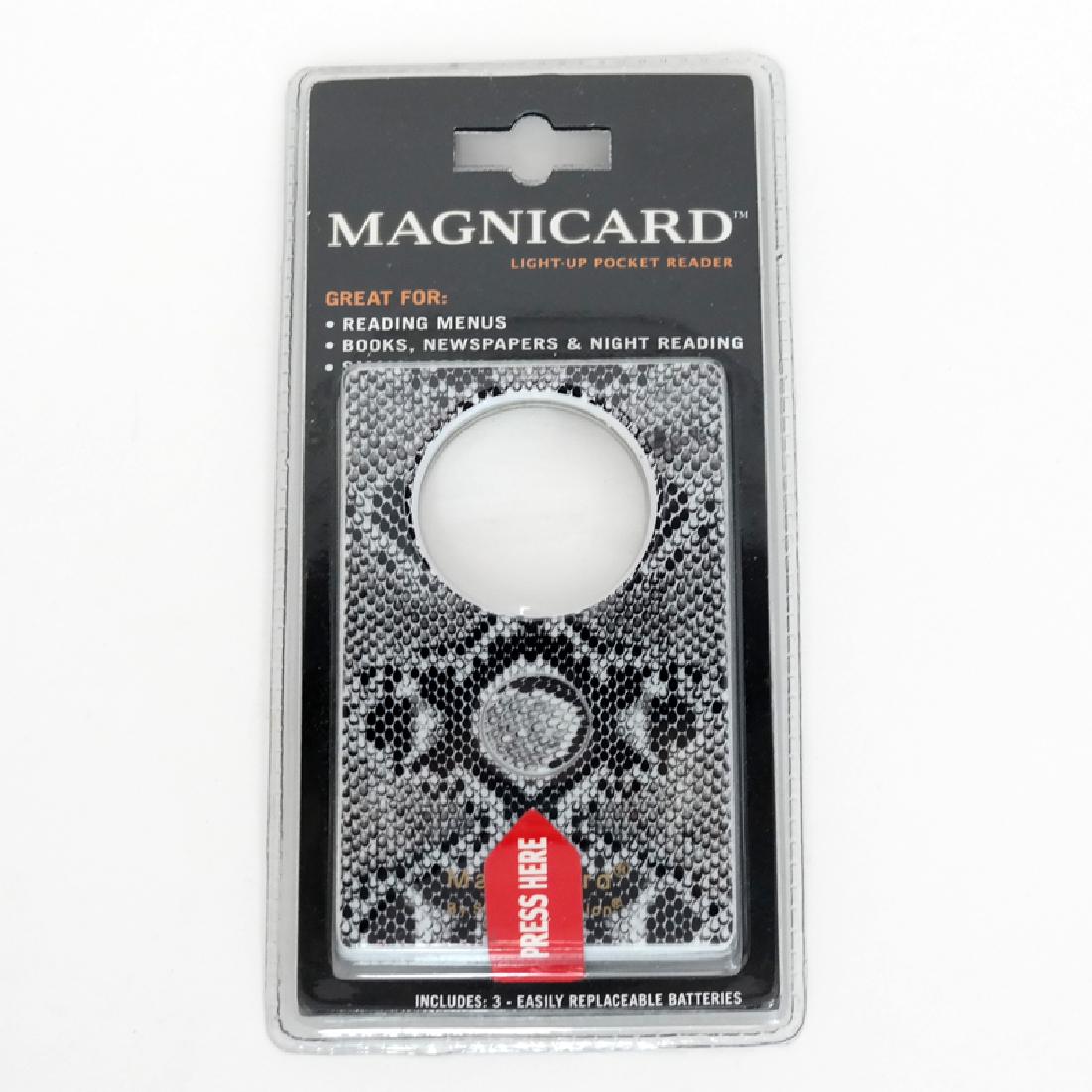 Light up pocket reader "Magnicard" in case, new. Reader: Light up pocket reader "Magnicard" in case, new. Reader comes with magnifying loop 1 1/4" in diameter and light. Case measured 3 3/8" x 2 1/8", has snake skin color. Condition excellent.