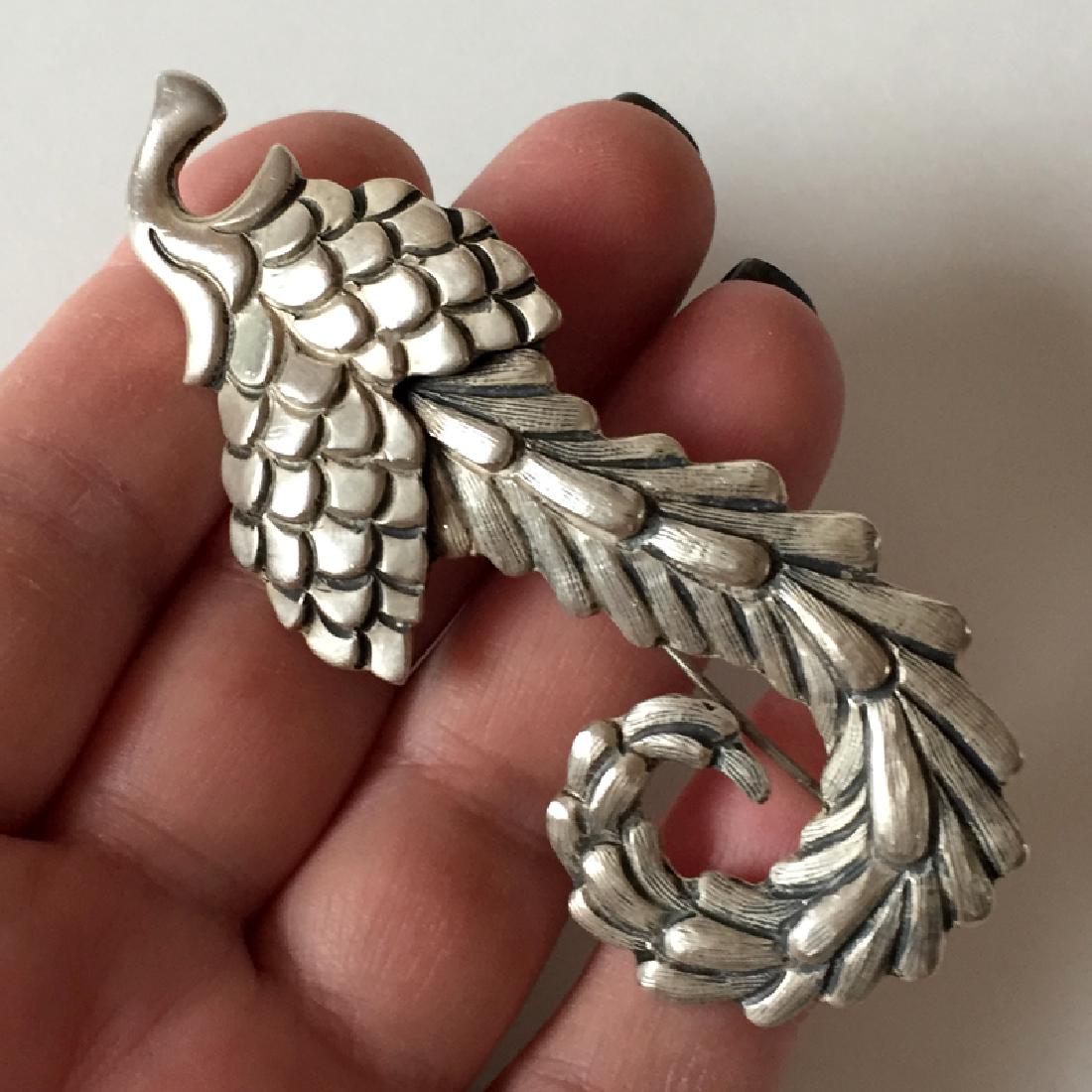 Vintage sterling silver antique finish "PARADISE: Vintage sterling silver antique finish "PARADISE FLOWER" shaped brooch. Weight 20.9 grams. Hallmarked LOS CASTILLO TAXCO MEXICO STERLING 149. Length 3". Condition very good.