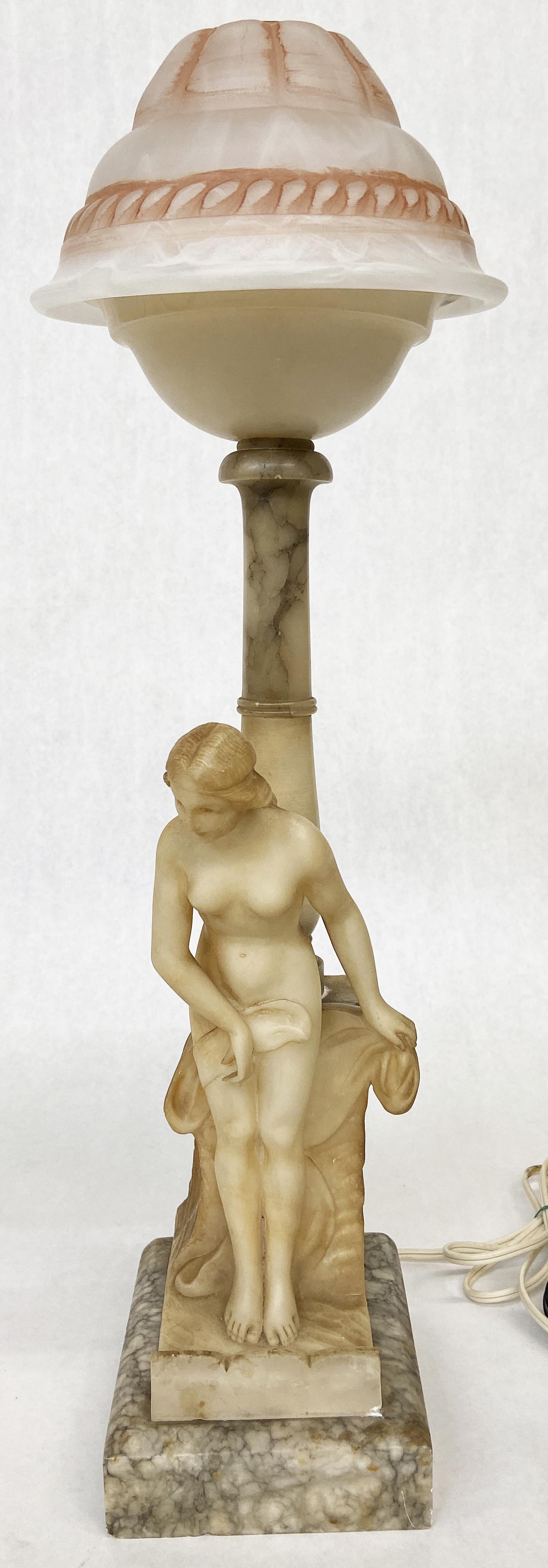 Art Deco Marble & Alabaster Nude Lady Lamp.: Measures 20" tall. The Shade does not match the lamp - it is a much newer shade. The shaft of the lamp has a couple of age cracks. There is a small chip on the lower right, where the alabaster figure 