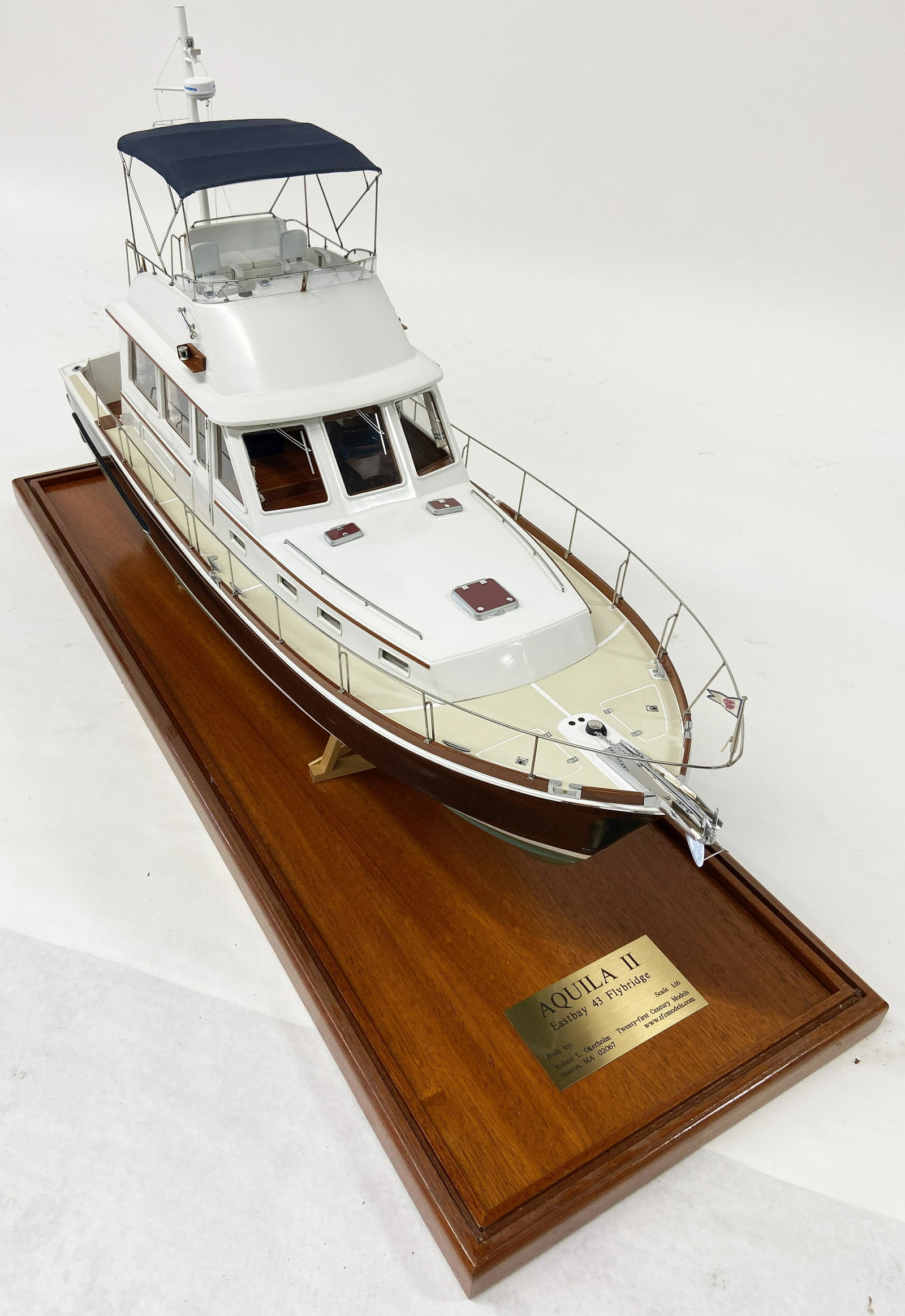 Aquila II Yacht or Cabin Cruiser Boat Model.: In an Acrylic case, attached to a wood base. The plate reads "Aquila II - Eastbay 43 Flybridge". Built by Robert L. Okerholm of Twenty-First Century Models. The case Measures 39" wide, 22 1/2" High, a