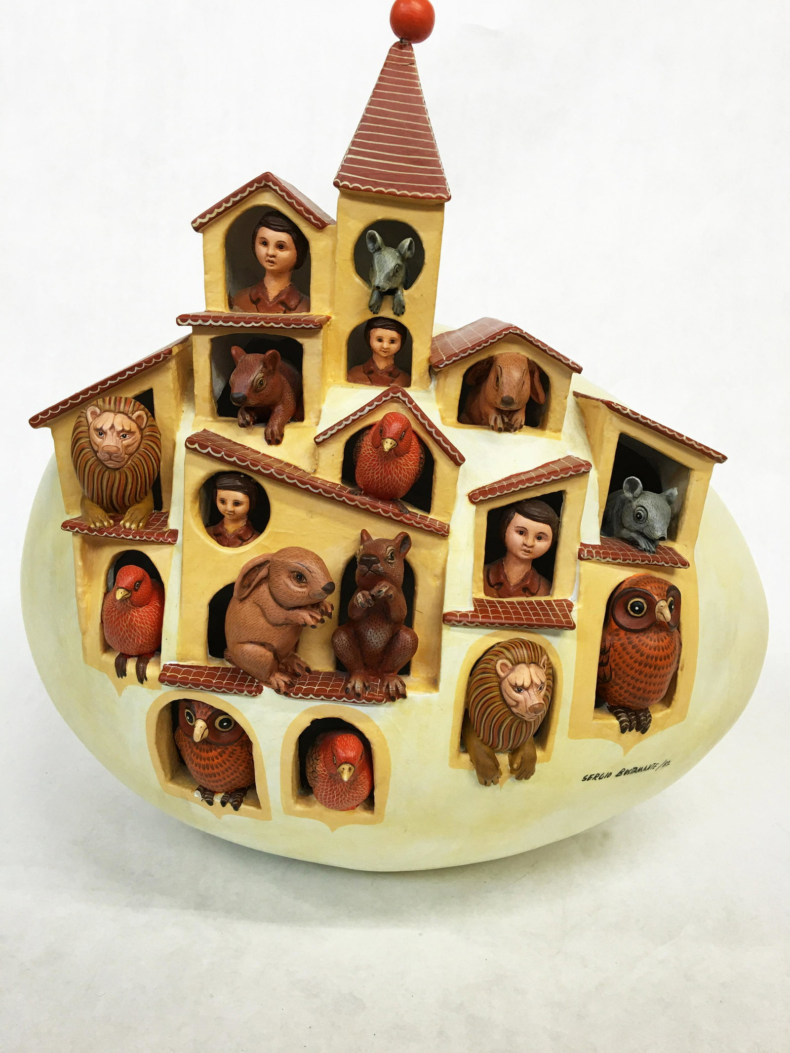 Sergio Bustamante Egg with Animals Sculpture.: Dated 1982. Has a Claw Missing off One of the Owls (See Photo). The Top Spire has also Been Repaired (see Photo). Some Crackleture on the Egg. Measures 19 1/2" Tall, and 19" Wide.