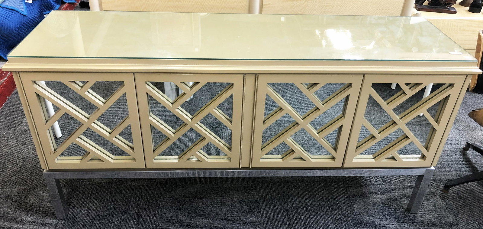 Mirrored Mid-Century Sideboard or Credenza.: With a Glass Top and a Chrome Base. It has a Baker Tag on the Back, but we Cannot Guarantee that it is a Baker Piece. Credenza Measures 67" Wide, 32" High, and 19" Deep.