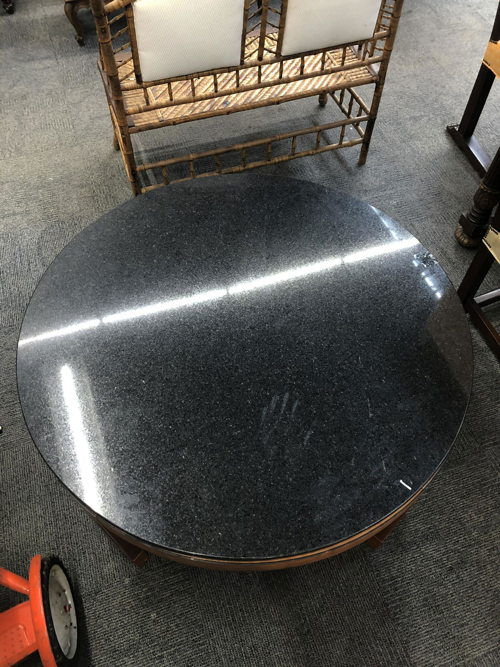 Sgd. Stickley Round Marble-Top Coffee Table.: With a Preto Aracruz Black Granite Top. Unfortunately, one Tiny Piece has Chipped off of the Granite. We managed to Save this Piece and Tape it to the Table. Measures 42" in Diameter and 19" High.