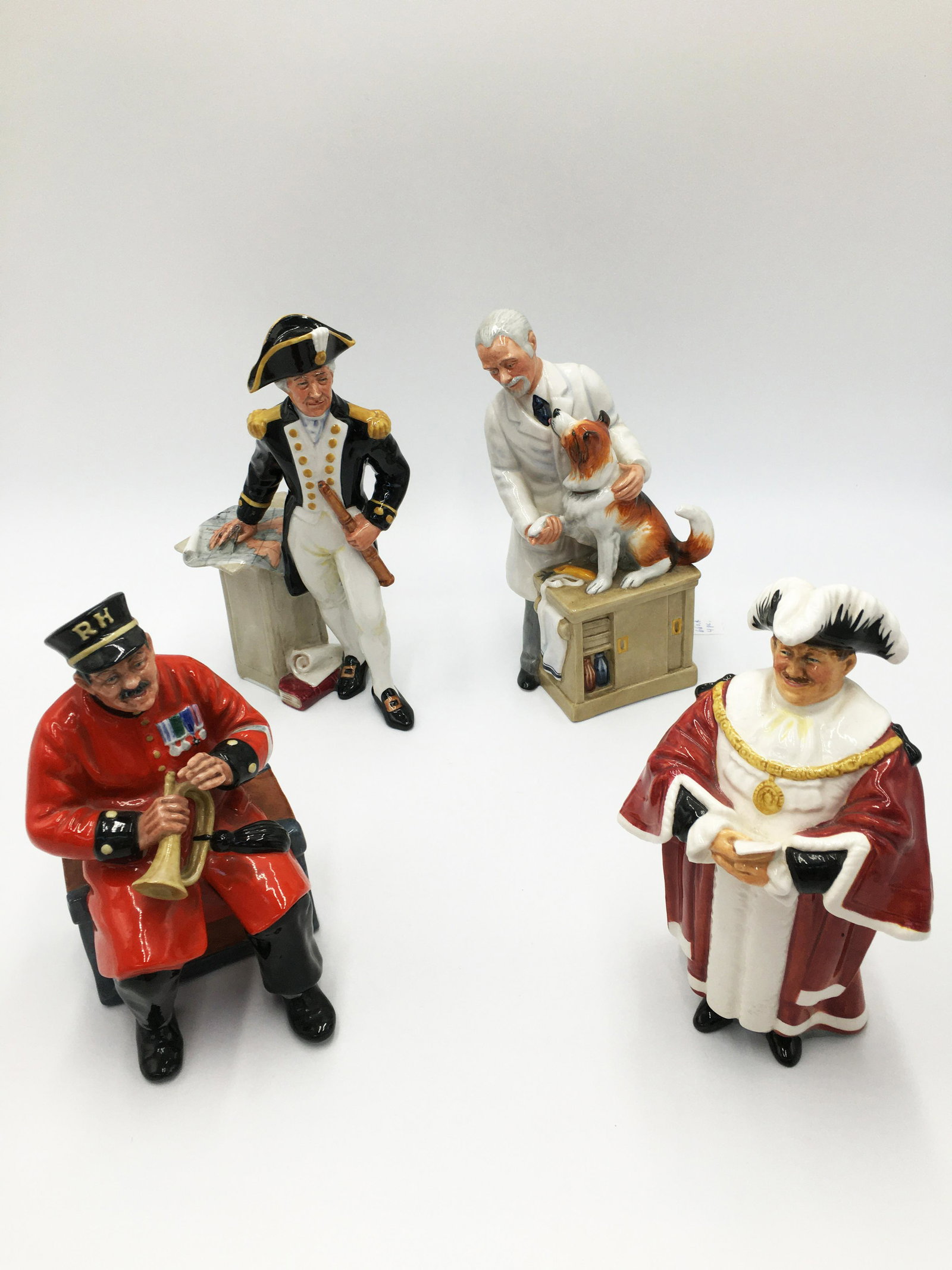 Lot of 4 Royal Doulton Figurines.: HN 2260, The Captain; HN 2484, Past Glory; HN 2288, The Mayor; HN 2731, Thanks, Doc.