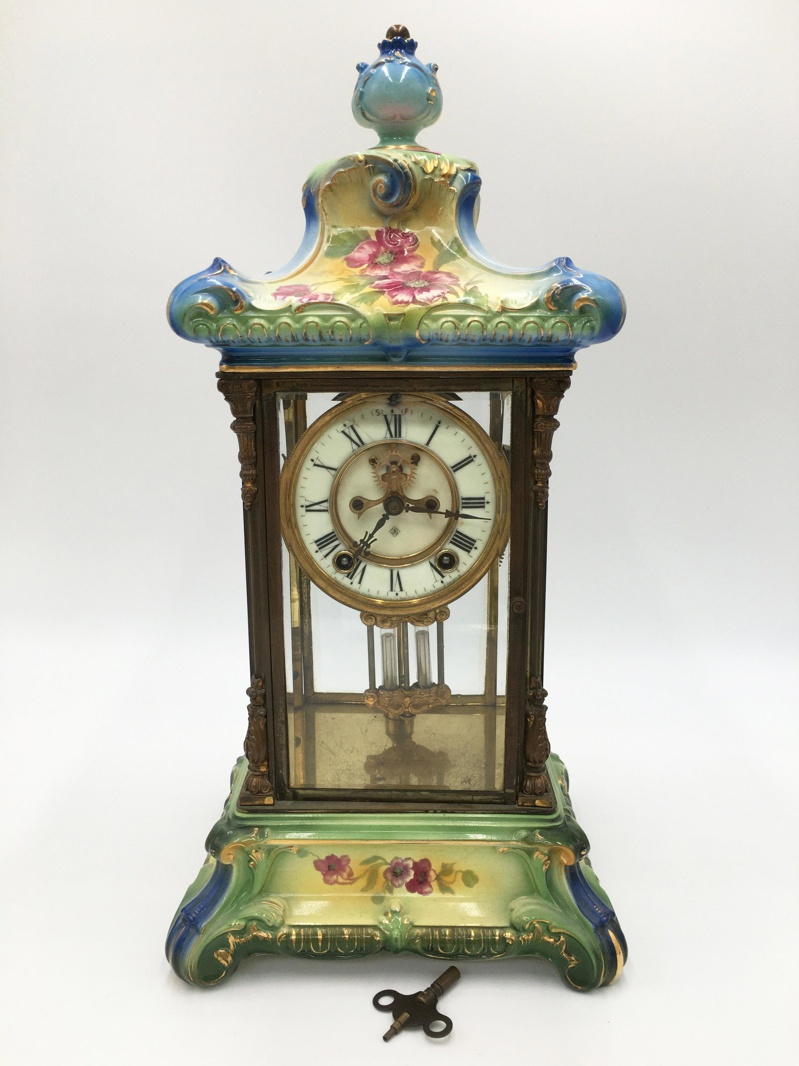 Ansonia Crystal Clock.: Measures 18.75" tall, Weighs 13.5 lbs. Not working. There is a small amount of damage / repair to the porcelain on the upper portion, rear of the clock. Third-Party Shipping Required.