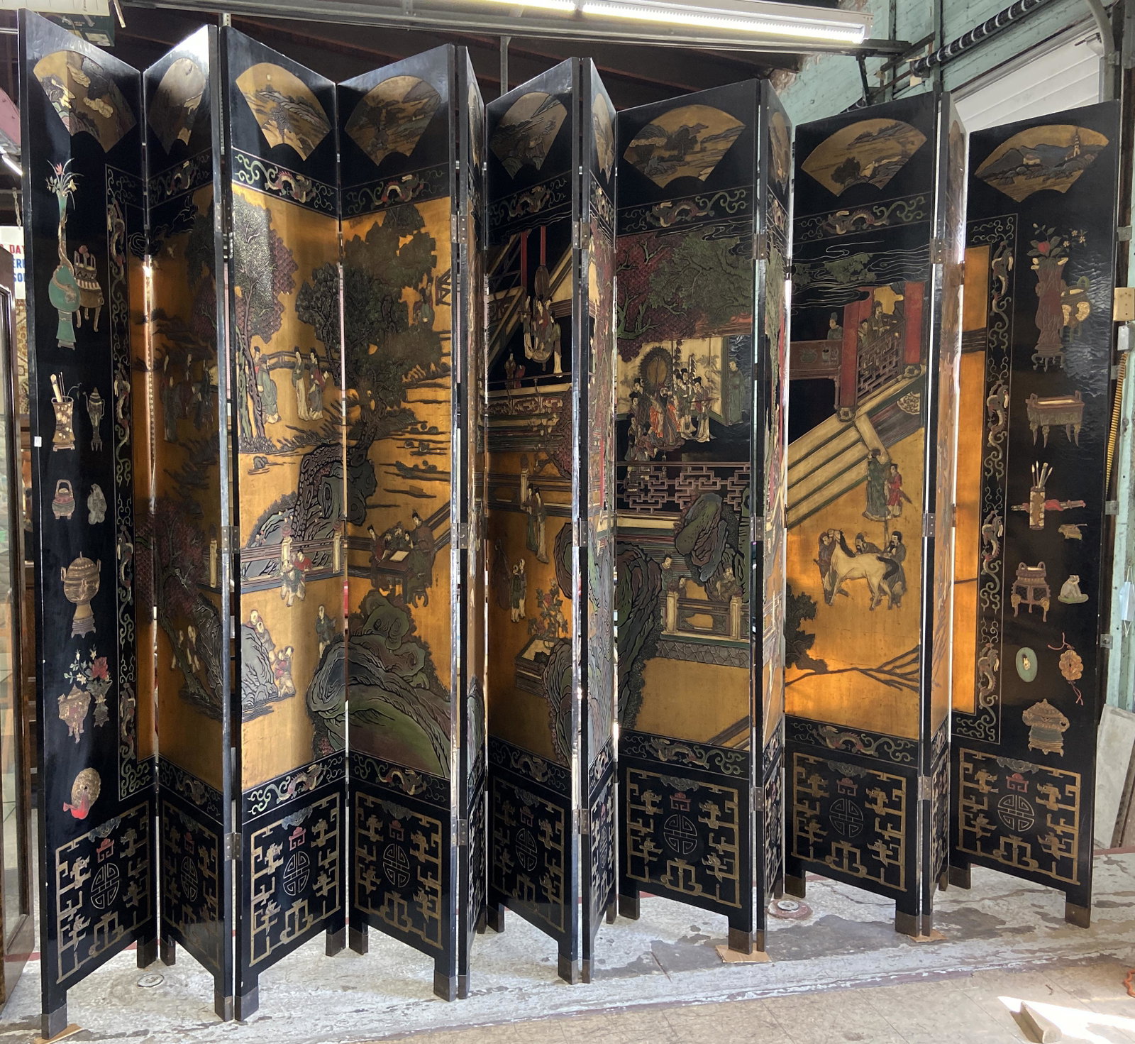 12-Panel 9' Tall Chinese Screen.: Has Different Toned Scenes on Each Side. Each Panel Measures 19 1/2" Wide. The Black Lacquer has Some Crackling to It. Third-Party Shipping Required.