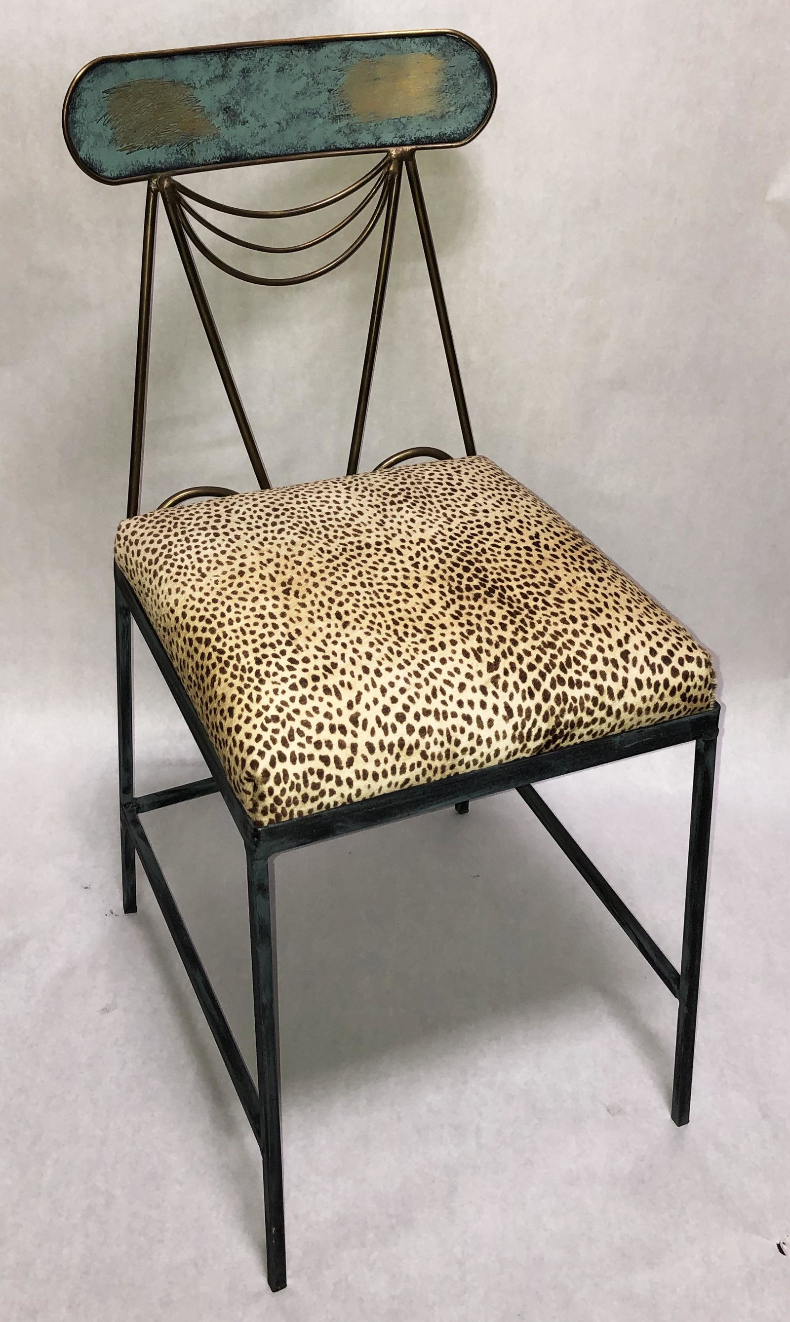 Mario Villa Side Chair w/Sling & Solid Oval Design: Metal frame, cheetah-dyed cowhide upholstery. Third-Party Shipping Required.