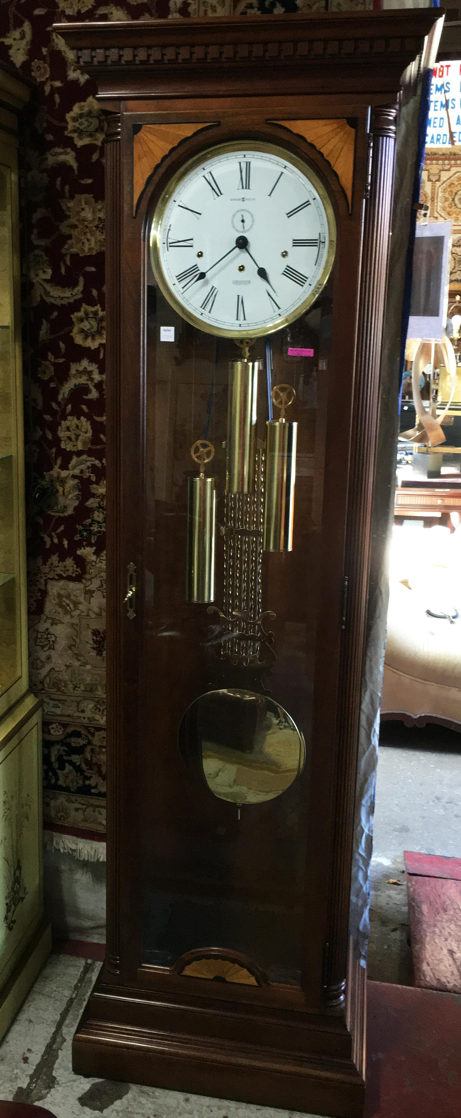 Howard Miller Dark Wood Grandfather Clock.: Ambassador Collection. It Runs Well. It Chimes. Third-Party Shipping Required.