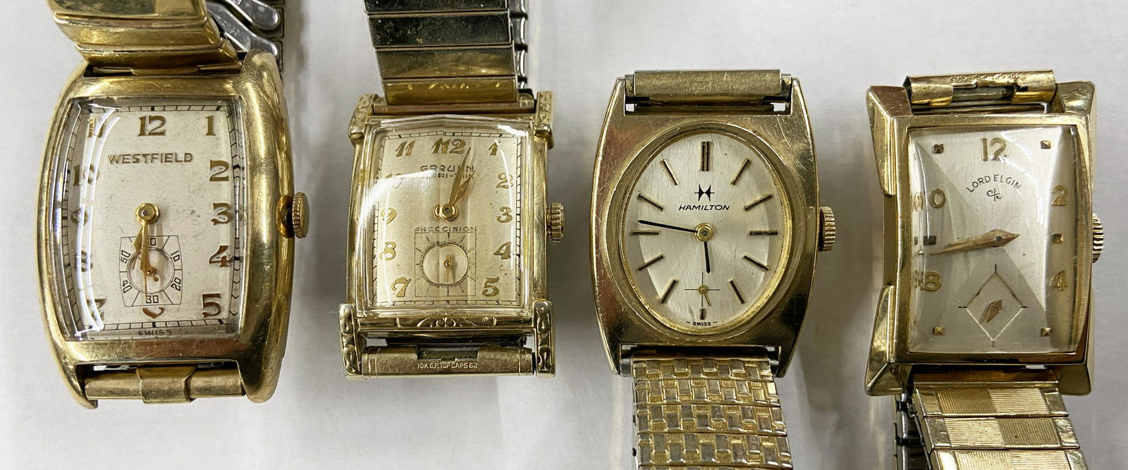Lot of 4 Men's Vintage Windup Watches.: A Lord Elgin, A Hamilton, A Gruen Veri-Thin Precision, and a Westfield. Two are Gold-Filled, Two have Base Metal Backs. All Four of them Tick.