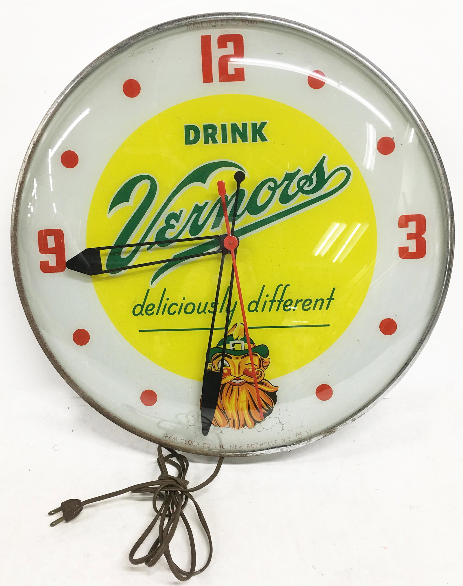 1957 Vernor's Pam Advertising Clock.: Measures 20" in Diameter. Has a bit of Crackling to It (Quite Noticeable when Clock is Lit Up). Clock is not Running, but it DOES light up. Third-Party Shipping Required.