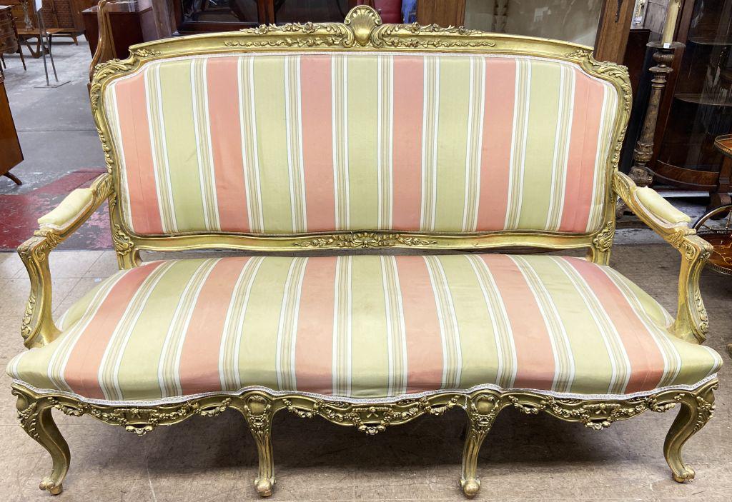 French-Style Gold-Gilded Sofa.: Measures 69" Wide. The Back Measures 46 1/2" High. The Upholstery has some Spots and Smears. Third-Party Shipping or Personal Pickup Required.