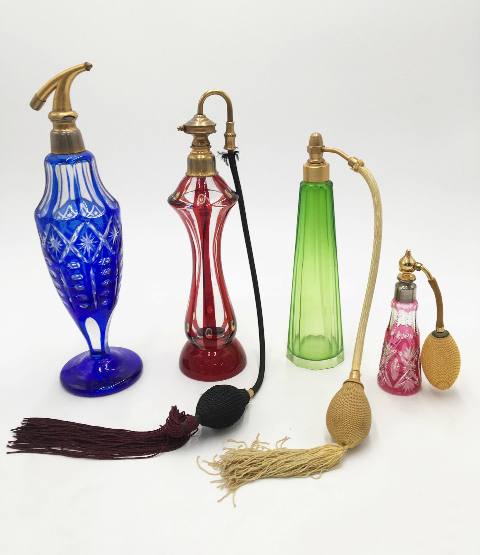 Lot of 4 Old Glass Tall Atomizers/Perfume Bottles.: Two are Bohemian Glass Type. One is Sgd. Czechoslavakia, the Tallest Blue One is Signed Made in France. This Tall Blue One Also has Damage on the Metal Area at the Top of the Bottle. These Vintage Bot