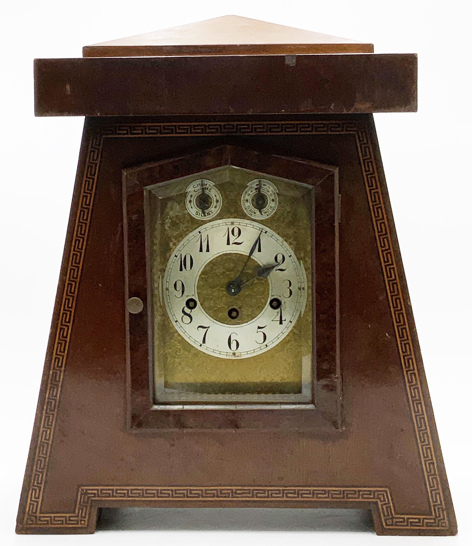 Arts & Crafts German Inlaid Wood Chiming Clock.: Has Missing Veneer. The Clock has a Pendulum but no Key. It appears to be Ticking. Clock Measures 20" Tall, 16 1/4" Wide at the Base, and 8 3/4" from Front-to-Back. Third-Party Shipping Required.