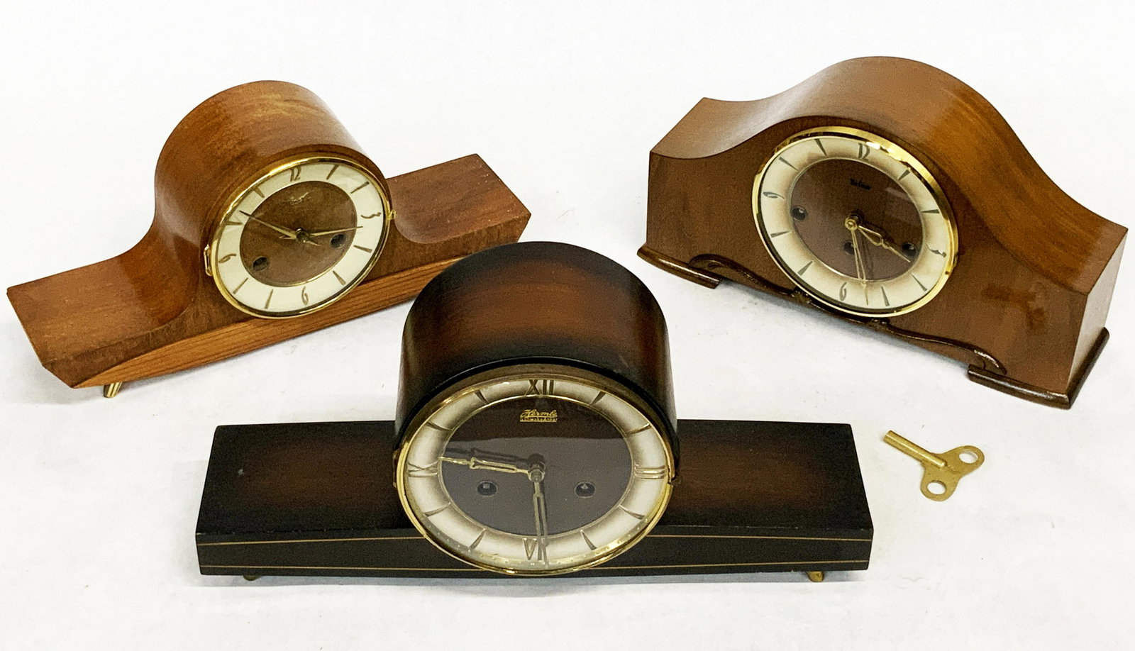 Lot of 3 Art Deco Mantel Clocks.: One is by Telep, and Two are by Hermle. The Two Hermles have Keys. One Seems to tick - it has a Pendulum. The Working Condition of the Other Two are not Known. The Telep does not have a Key. These Mea