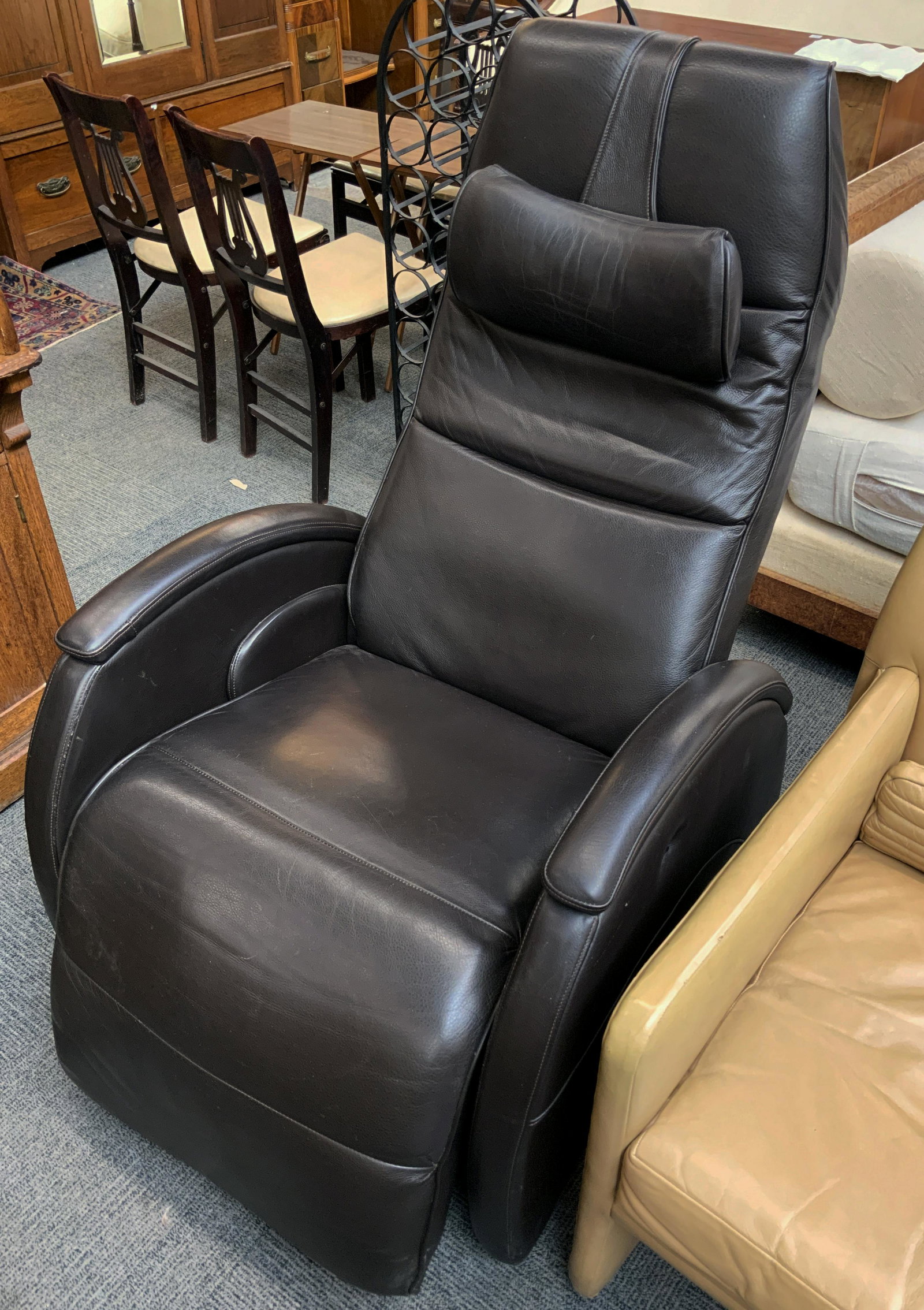 Black or Dark Brown Leather Electric Recliner.: It Works. In NIce Condition. The Back Measures 46" Tall. Third-Party Freight Shipping or Personal Pickup Required.