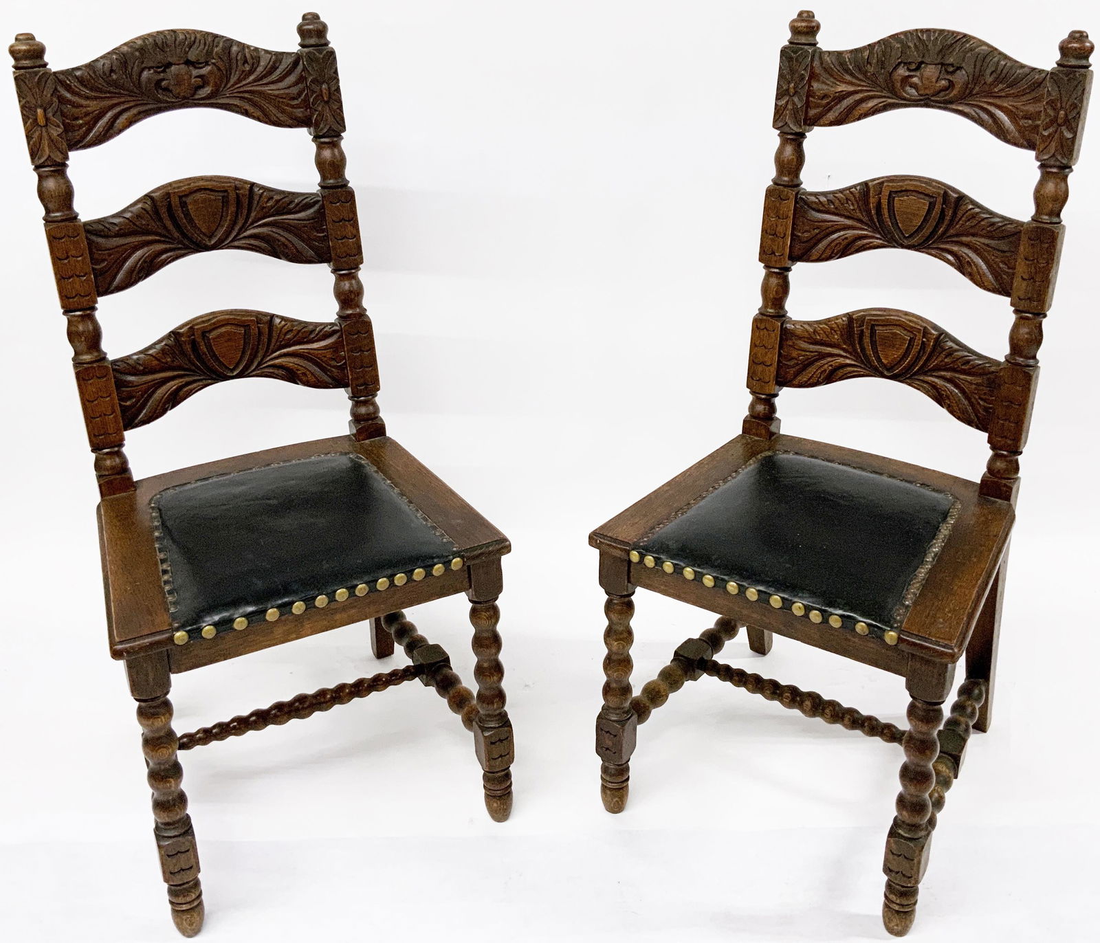 Pr. of Antique Oak North Wind Face Dining Chairs.: Or, Ladderback Chairs. These Measure 41 1/2" Tall, and have a bit of Wear. Third-Party Shipping or Personal Pickup Required.
