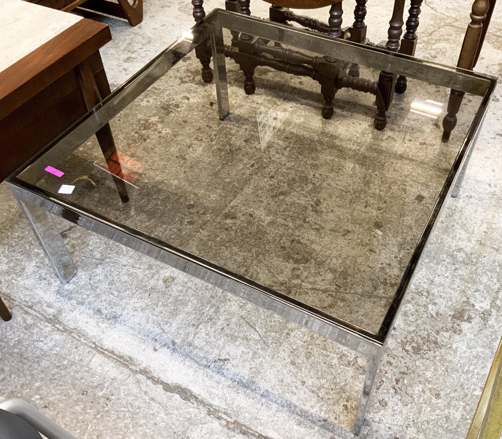 Milo Baughman Square Chrome & Glass Coffee Table.: MId-Century. The Glass Top has Some Scratches. Measures 15" Tall. Surface Measures 32" Square. Third-Party Freight Shipping or Personal Pickup Required.