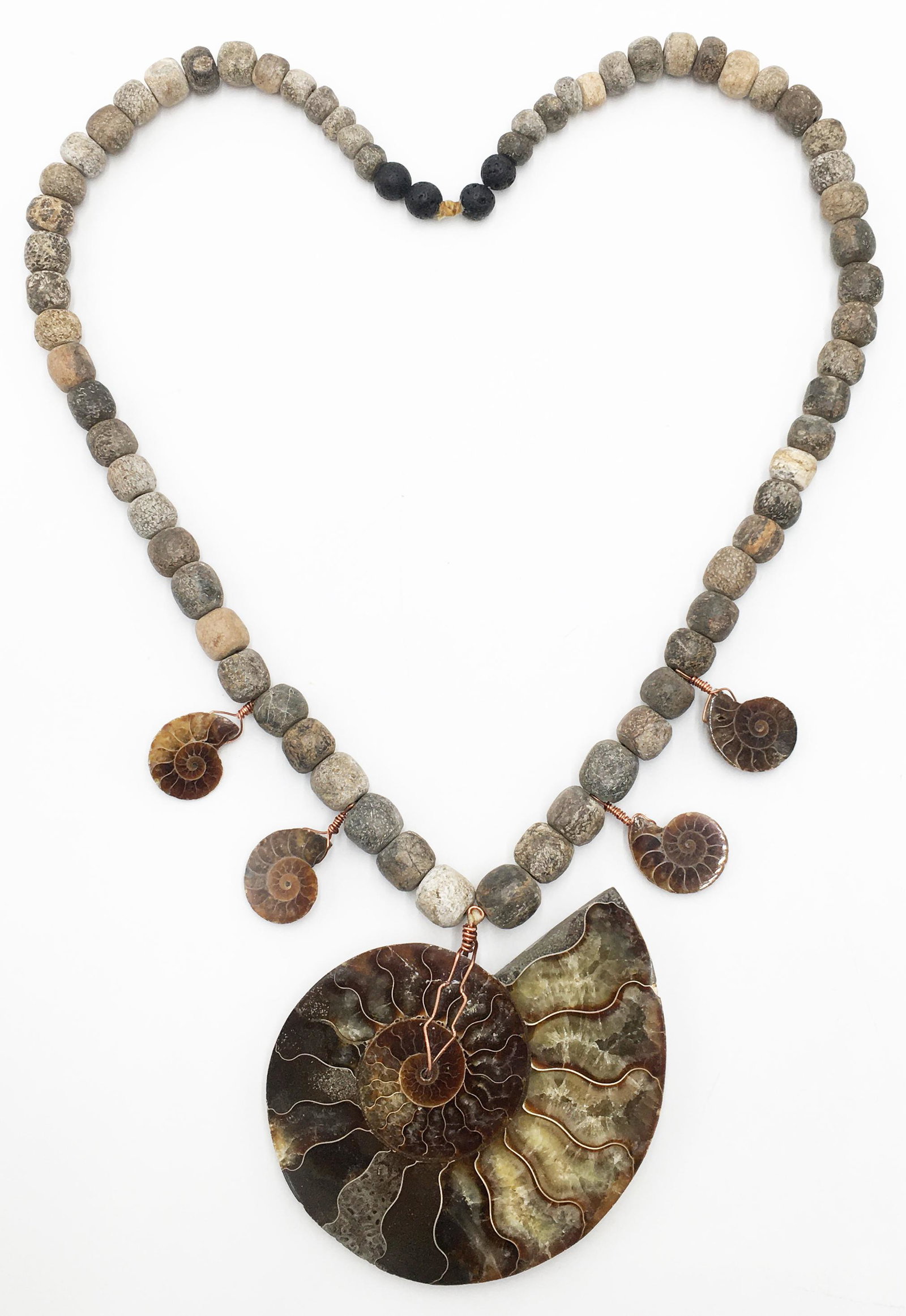Necklace with 5 Fossilized Ammonite Pendants.: The Necklace is Comprised of Mastodon Bone Beads and Lava Beads. The Necklace Portion Measures 28" Long. The Large Ammonite Pendant Measures 4 1/4" Wide. The Small Ammonite Pendants Measure Approximat