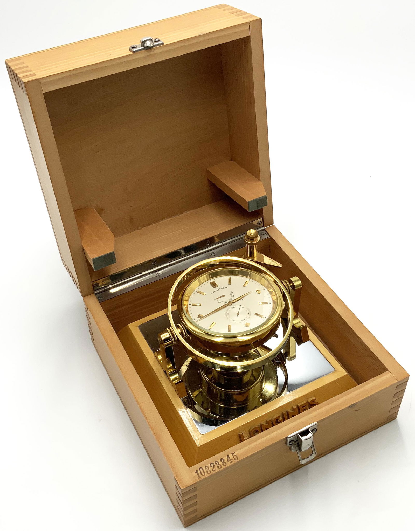 Brass Longines Chronometer in Wood Case.: A Very Fine Clock with a Beautiful Mechanical Movement. Has Some Wear in the Stem Area (See Photo). Clock Measures 3 1/2" in Diameter. Box which Houses it Measures 5 1/2" Tall by 8 3/8" Wide by 8 3/8"