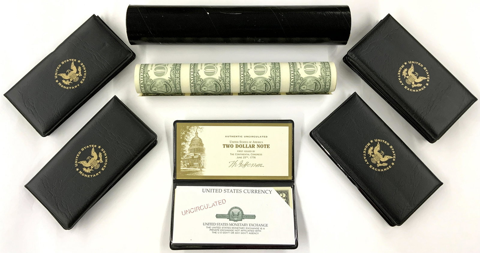 Lot: Sheet of 8 $1 Bills & 10 Unc. $2 Bills.: The $1 Sheet is in a Tube from the Bureau of Engraving & Printing, with an Additional Paper Inside. The $2 Notes are in little Folders from the United States Monetary Exchange, and are Uncirculated.