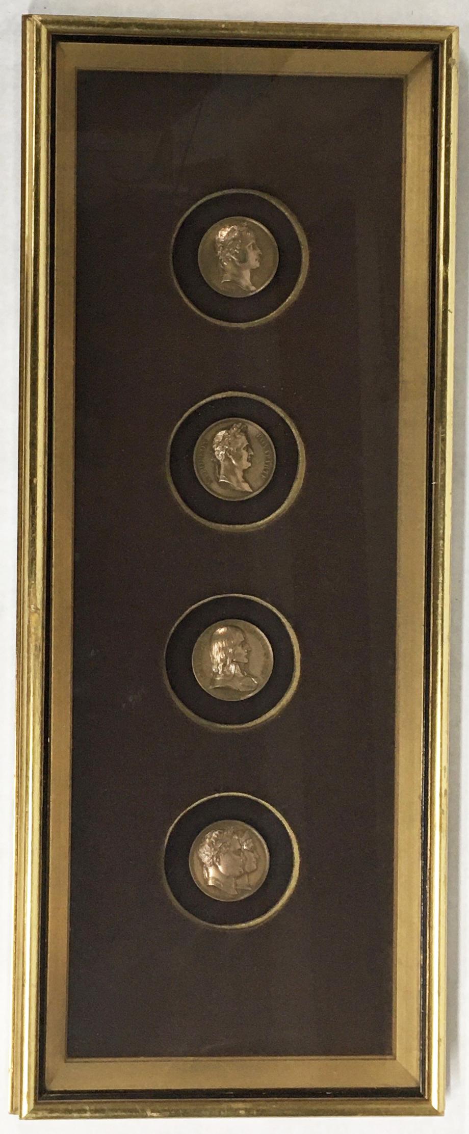 Lot of 4 Napoleanic Bronze Medallions, Framed.: These are Signed F. Andrieu (2 Pcs.), A. Bovy, and E. Rogatf. The Medallions Measure 1 1/2" in Diameter. The Frame measures 21 1/2" x 8 3/4". Third-Party Shipping Required.