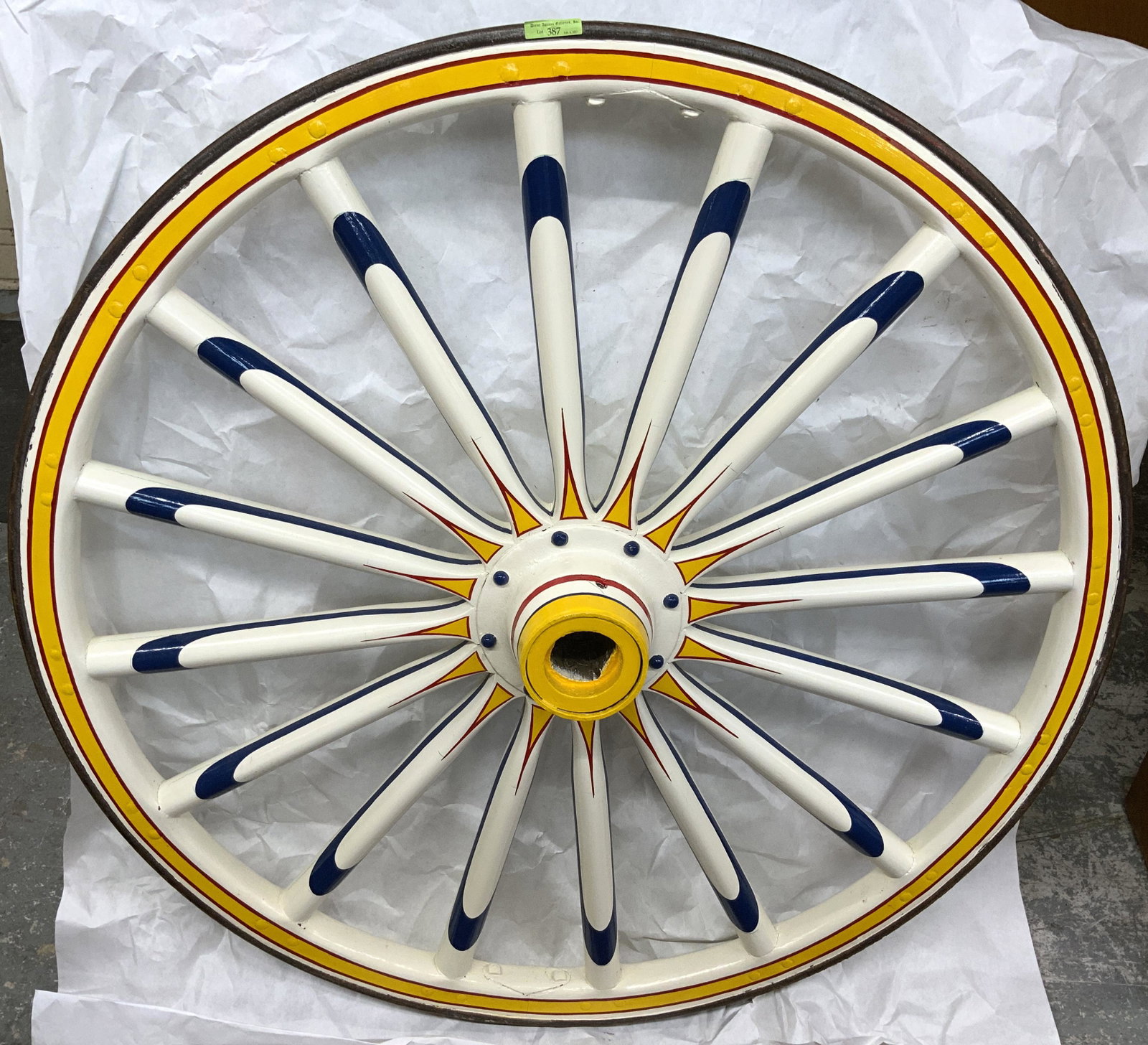 Old Painted Circus Wagon Wheel.: With an Iron Outer Rim. Measures 41 1/2" in Diameter. Third-Party Shipping or Personal Pickup Required.