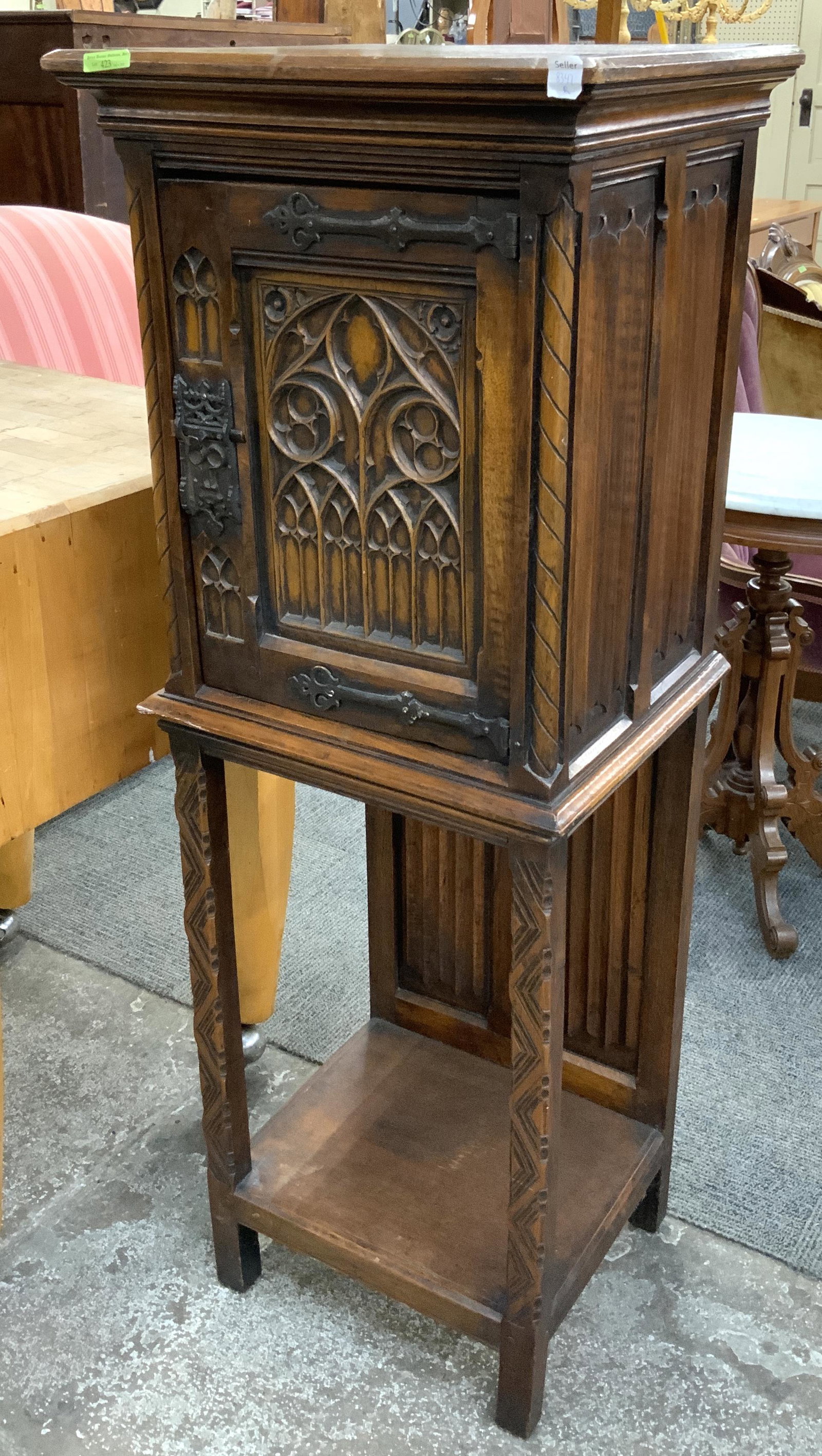 Gothic-Style Carved Wood Telephone Cabinet.: Measures 49 1/2" Tall, 17" Wide, and 15" Deep. Has a Scratch on the Top and Some Wear to the Front Right Top Corner. Third-Party Freight Shipping or Personal Pickup Required.