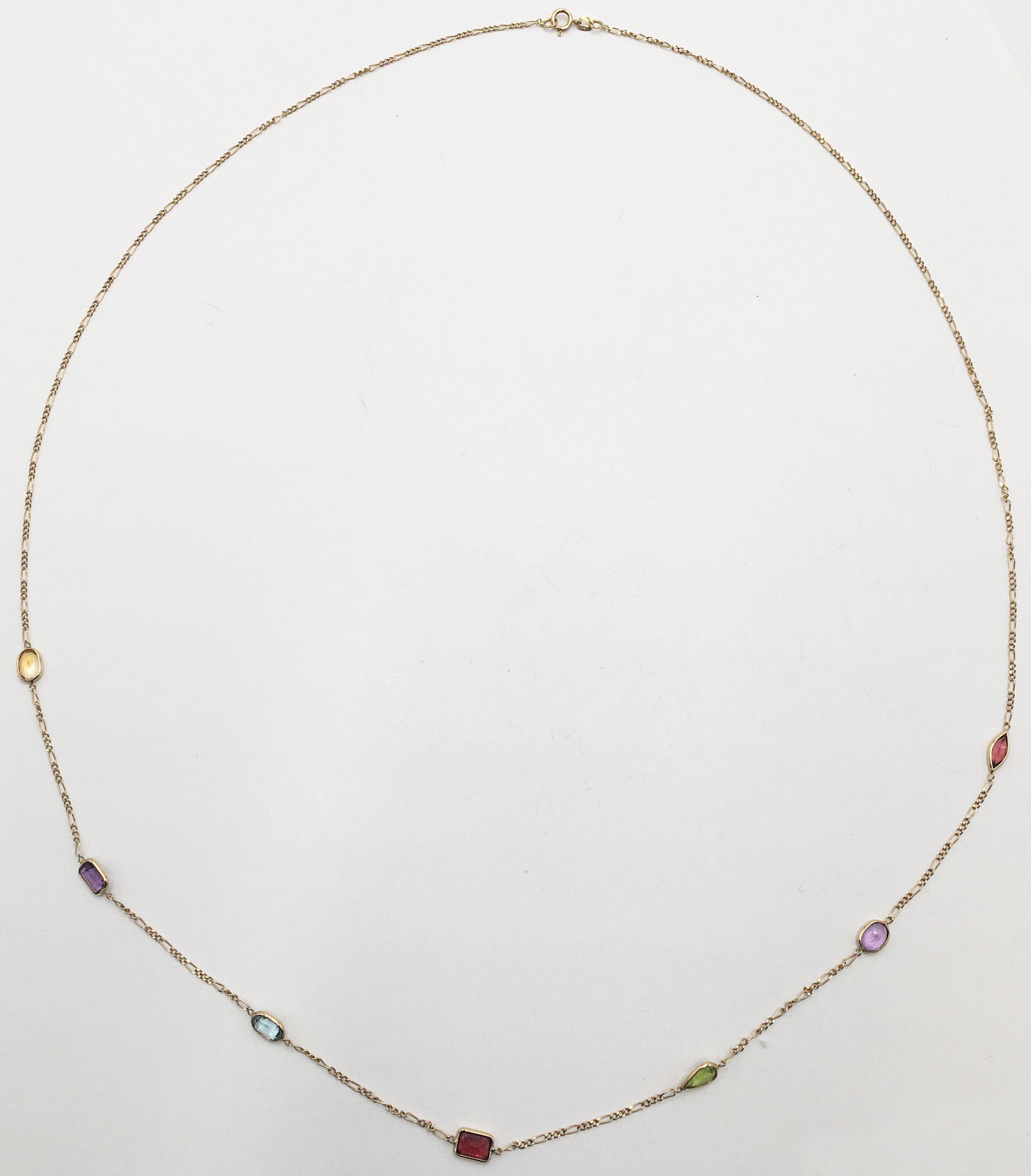 Thin 14K Necklace with Various Gemstones.: Gemstones Include Garnet, Amethyst, Blue Topaz, Citrine and Peridot. Necklace Measures 28 1/2" Long, and Weighs 3 Pennyweight. Largest Stone Measures 6.5mm x 4mm.