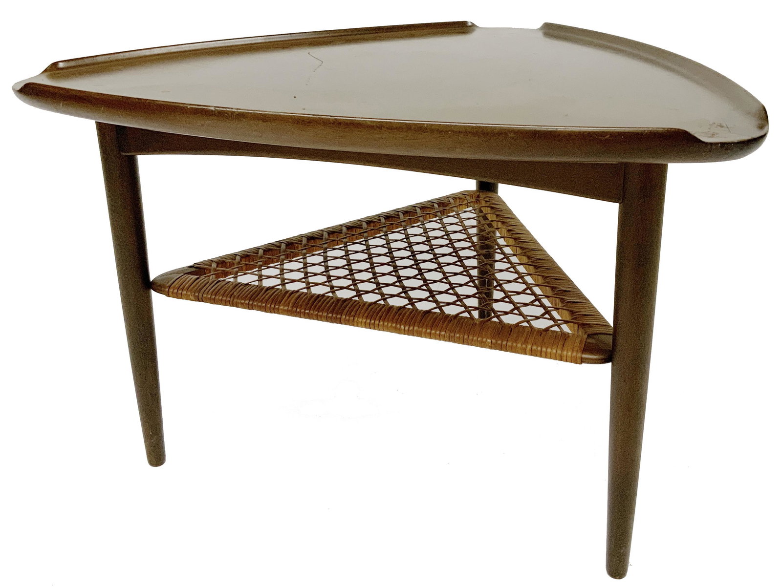 Kai Kristiansen for Selig Guitar Pick Table.: Danish Modern Teakwood. Has the Selig, Denmark Tag. Has Curled Lip Edges. The Lower Level is Woven Rattan. Triangular Shape - Each Side Measures 26" Long. The Table Measures 17 1/2" Tall. The Table ha