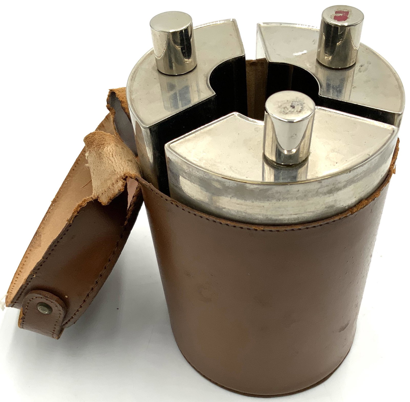 Antique 3-Flask German Metal Liquor Kit.: In a Leather Case. The Tin-Lined Liquor Kit is Monogrammed "RHS". Measures 6 1/2" Tall.