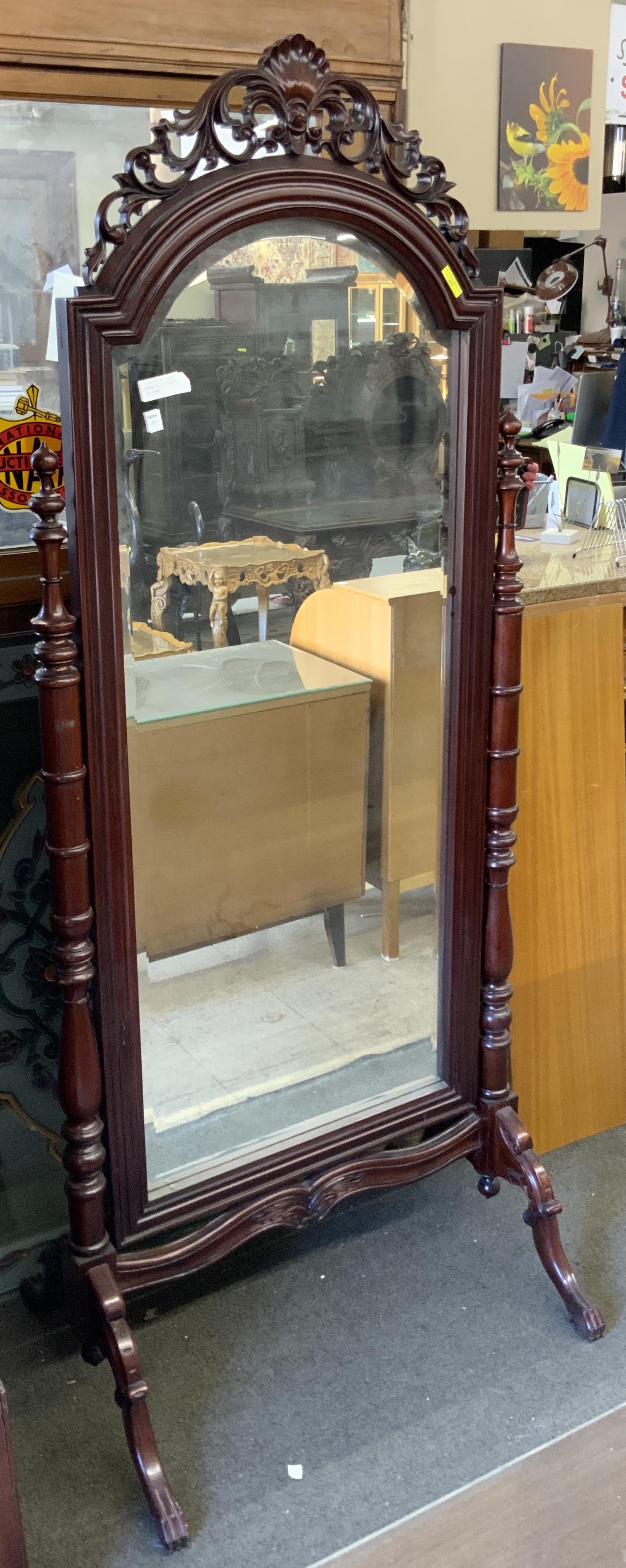 Chippendale-Style Mahogany Cheval Mirror.: A Newer Carved Full-Length Swivel Mirror. Measures 76 1/2" Tall and 31" Wide. Has a bit of Wear. Third-Party Freight Shipping or Personal Pickup Required.
