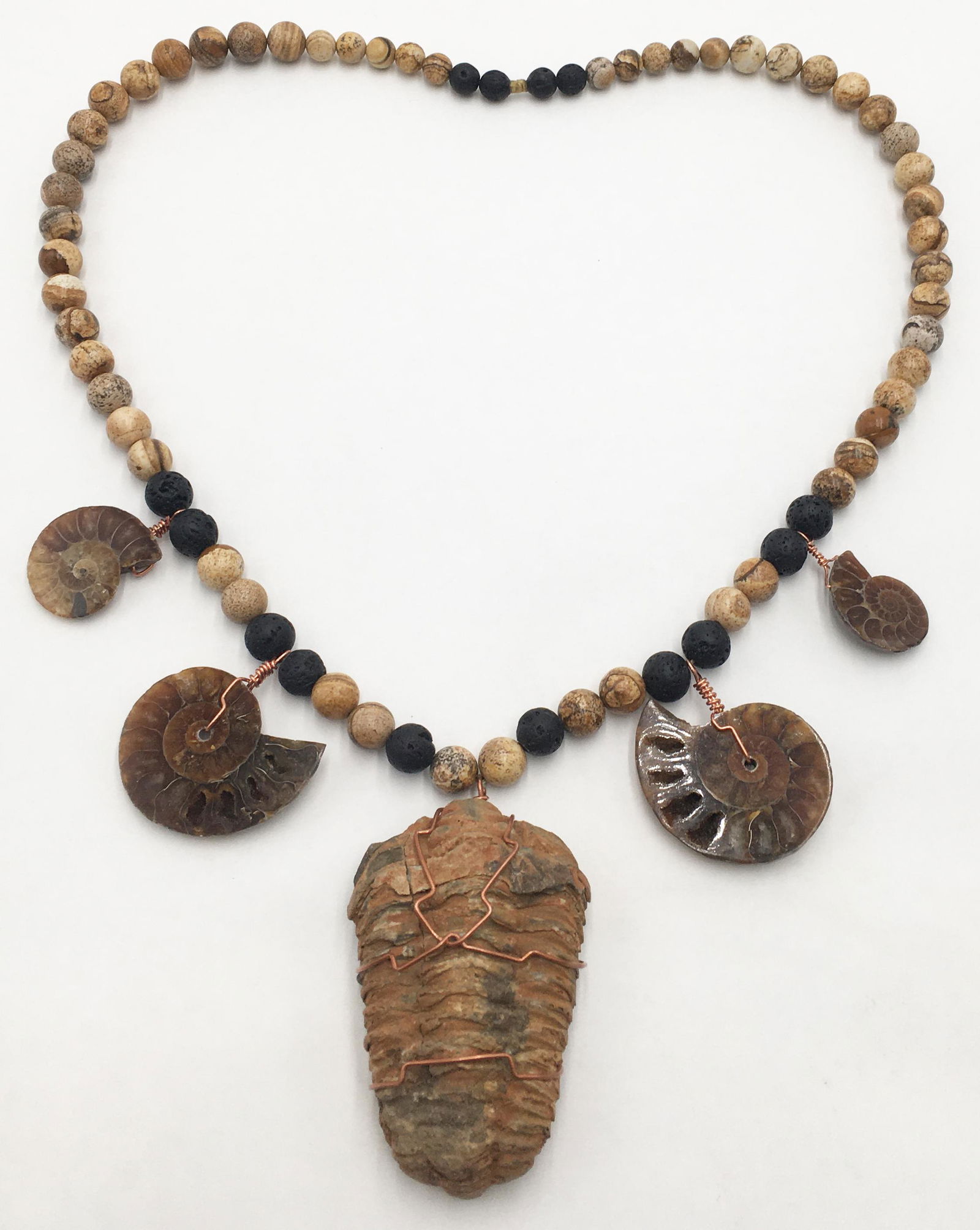 Necklace with Trilobite and Ammonite Fossils.: The Necklace is Comprised of Jasper and Lava Beads. The Necklace Portion Measures 26" Long. The Fossilized Trilobite, Appx. 395 Million Years Old, Measures 2 7/8" Long. The Ammonite Fossils, Appx. 350