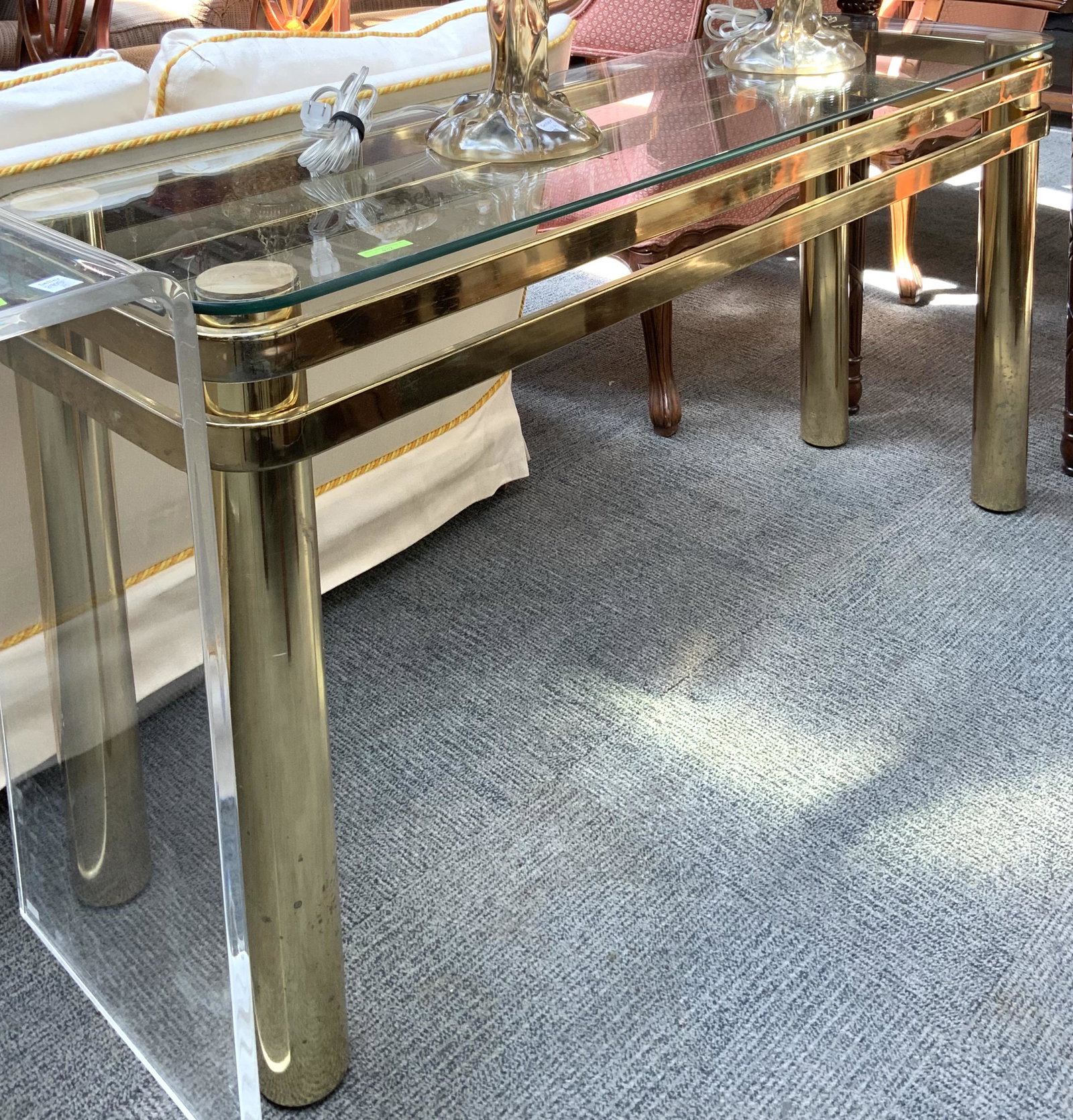 Milo Baughman Brass-Like Table with Glass Top.: Measures 27" Tall, 52" Wide, and 16" Deep. Third-Party Freight Shipping or Personal Pickup Required.