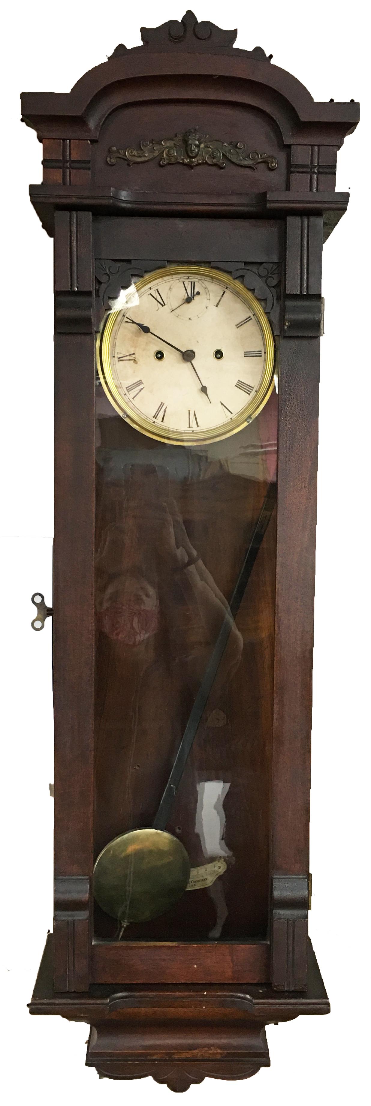 Long Antique Dark Wood New Haven Clock.: Working Condition is not Known. With Pendulum and Key. Measures 49" Long and 13 3/4" Wide. Third-Party Shipping Required.