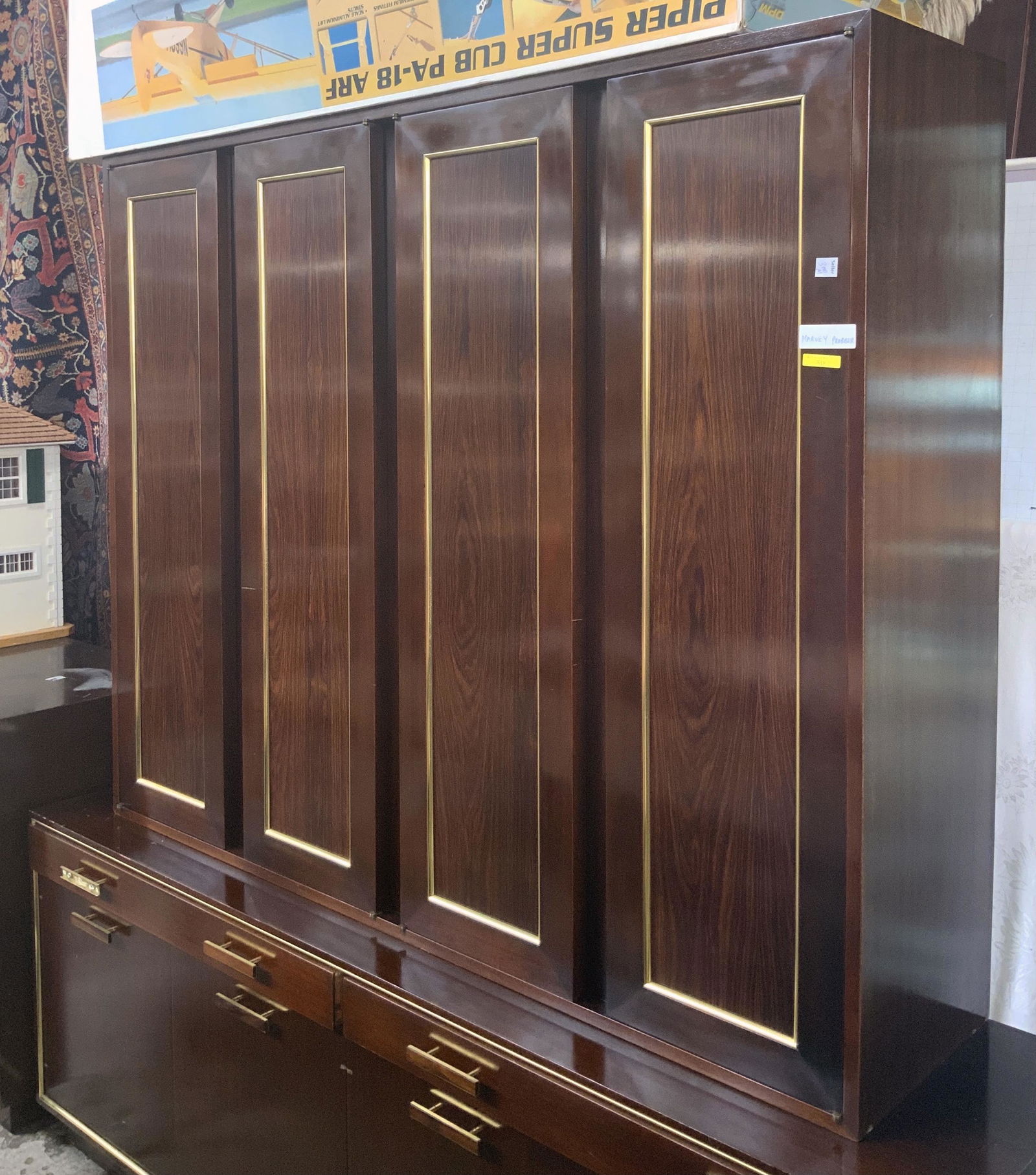 Signed Harvey Probber MId-Century Cabinet.: Dark Wood, Possibly Mahogany and Rosewood. Has some Scratches, including a Pretty Noticeable Scratch on One of the Doors, but is in Overall Fair Condition. Measures 71 1/2" Wide, 74" High, and 18" Dee