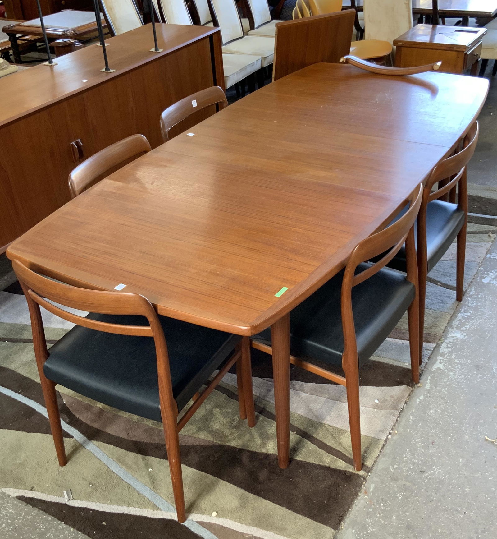Teakwood Danish Modern Dining Table & 6 Chairs.: Unsigned. Comes with Two Leaves. One of the Chairs is Pretty Badly Broken at the Top, and in Need of Repair. The Table Measures 38" Wide by 62" Long, without the Leaves Inserted. Each Leaf adds 16 1/2