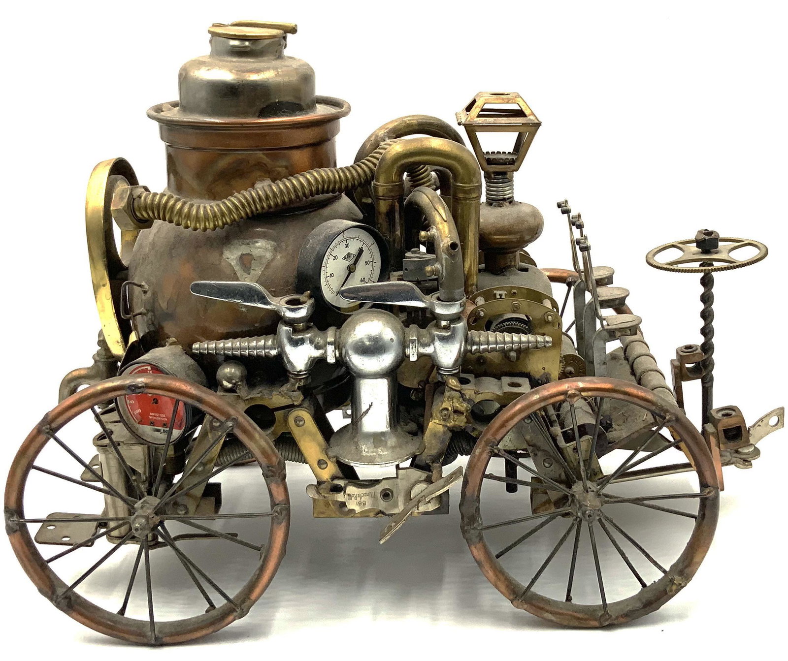 Sonny Dalton Steampunk Sculpture.: Signed with a Small Round Artist's Tag. The Sculpture Measures 18" Wide, 14" High, and 9" Deep. Third-Party Shipping or Personal Pickup Required.