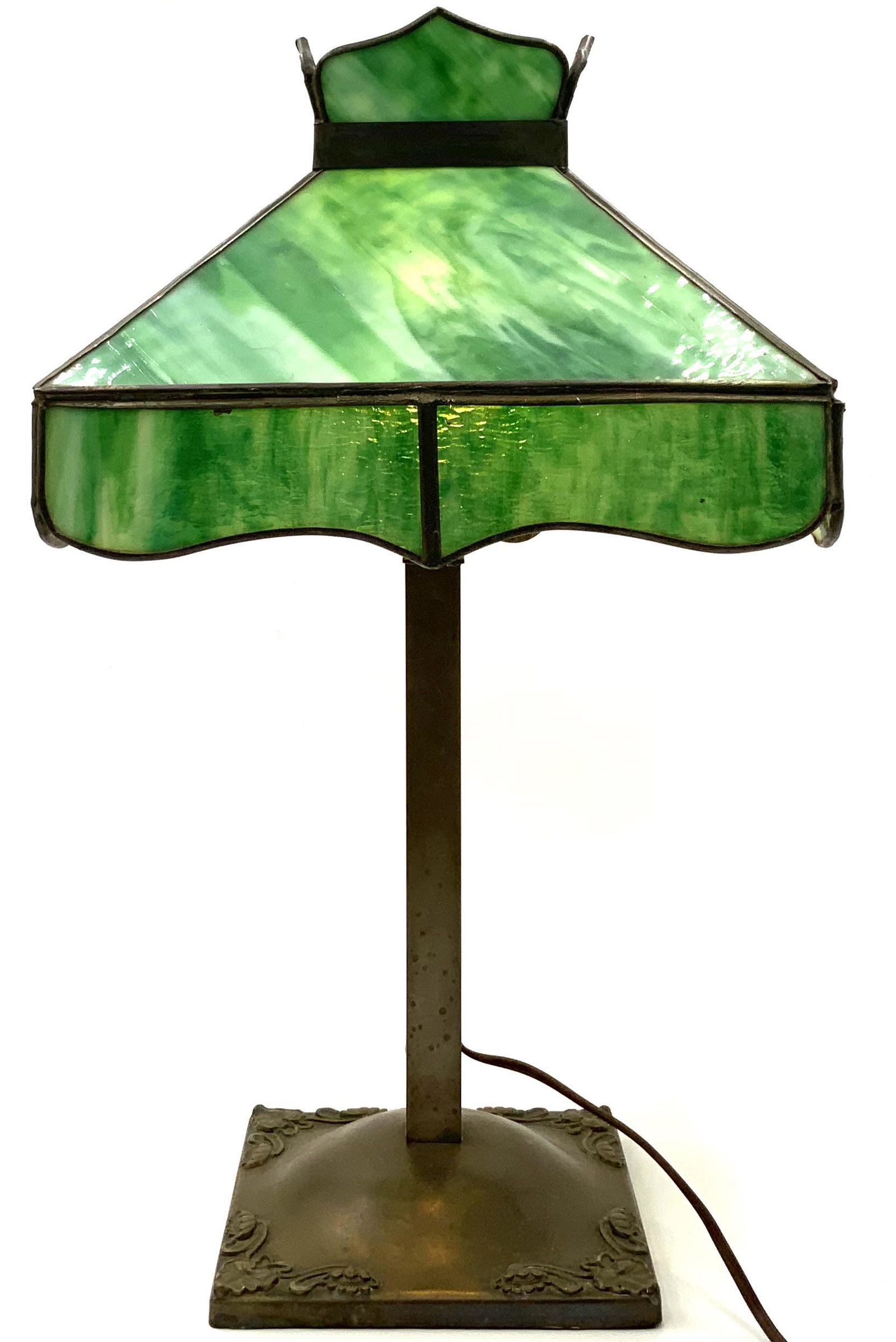 Antique Green Slag Glass Lamp with Metal Base.: The Base has Leaf and Flower Designs on each Corner. The Shade has Signs of Corrosion on the Top Metal Band, but Overall the Lamp is in Good Condition for its Age. All the Slag Panels are in Good Cond
