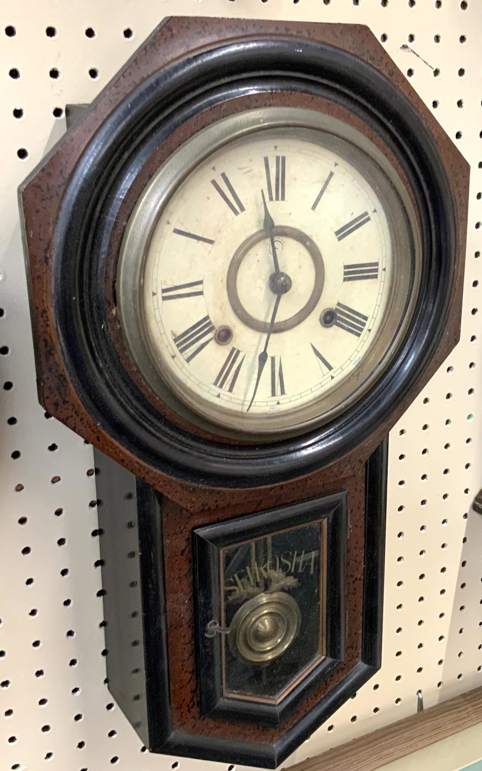 Seikosha Antique Wood Wall Clock.: With Pendulum and Key. Measures 22" Long, and the Head Measures 12" Wide. Has a bit of Wear on the Top. Working Condition is not Known. Third-Party Shipping or Personal Pickup Required.