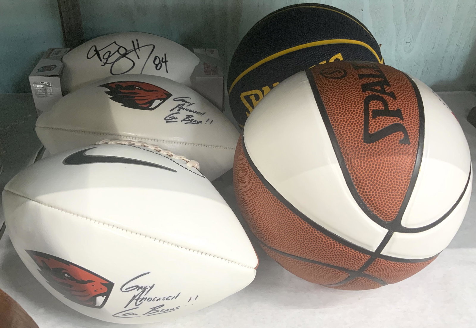 3 Autographed Footballs, 2 Autographed Basketballs: Sold as one Lot. Two Footballs are Signed by Oregon Beavers Coach Gary Andersen. These Footballs are Nike Vapor Elite Autograph Footballs, each with a Beavers Logo. The Other Football is an unknown si