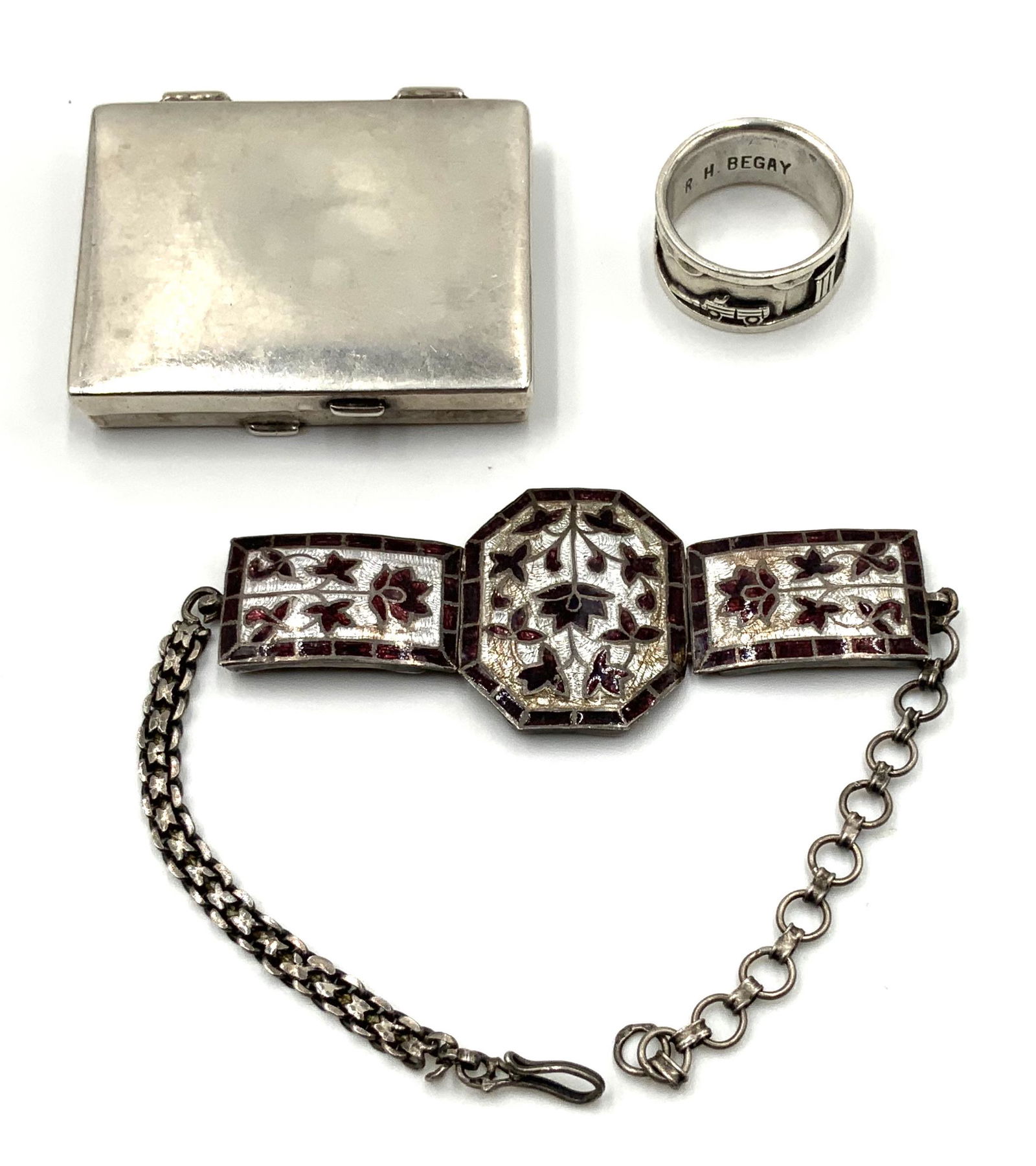 Lot: 3 Pcs. Sterling Silver Jewelry & Pill Box.: A Sterling Pill Box signed "FP" (1 1/2" x 2" x 5/16" Thick, Has a Small Dent on the Top), a Sterling Silver Native American Indian Ring signed R.H. Begay (3/8" Wide Band, Size 8 1/4), and a Sterling S