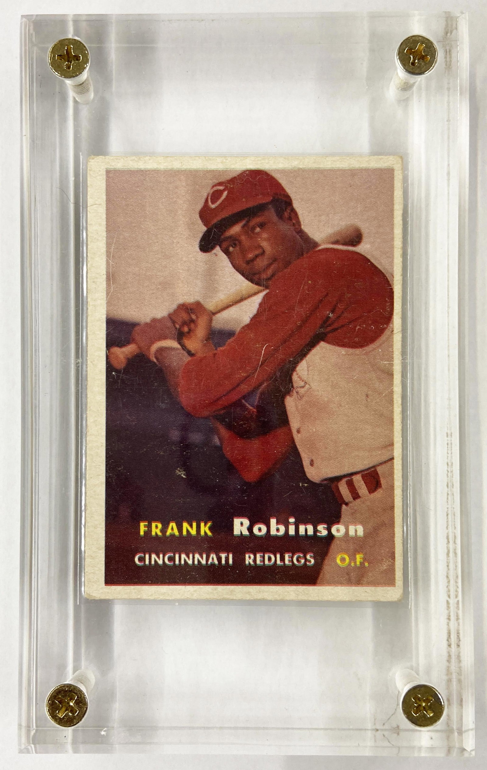Frank Robinson Rookie Baseball Card, Topps #35.: A 1957 RC (Rookie Card). In Nice Condition, but the Corners are not Perfect, and it is not Centered. In a Lucite Case. The Scratch in the Photo is a Scratch in the Lucite Case. The Card is Ungraded.