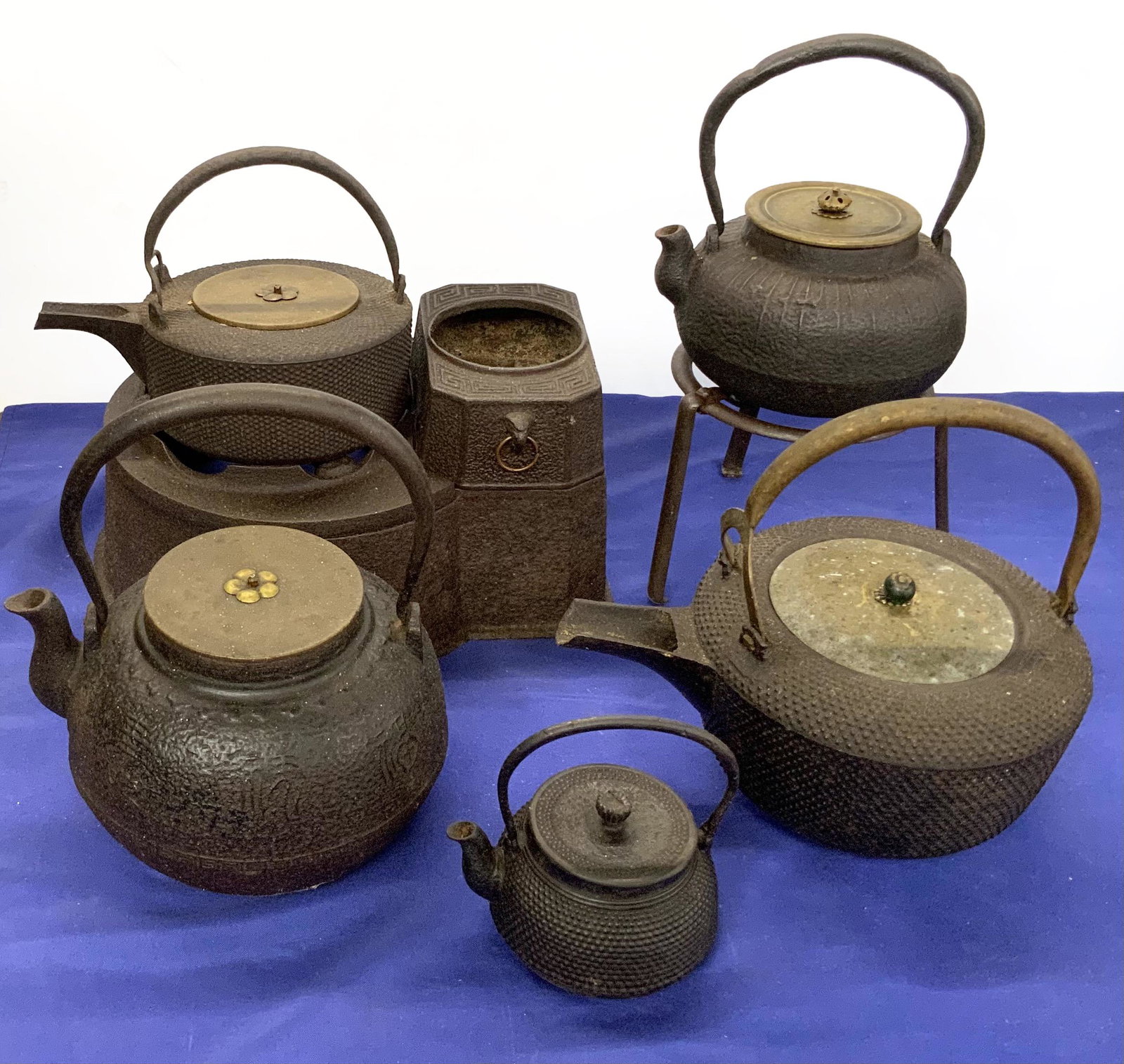 Lot of Older Iron Asian Pots, Stand, and Burner.: The Largest Teapot Measures 9 1/4" to the Top of the Handle. Third-Party Shipping or Personal Pickup Required.