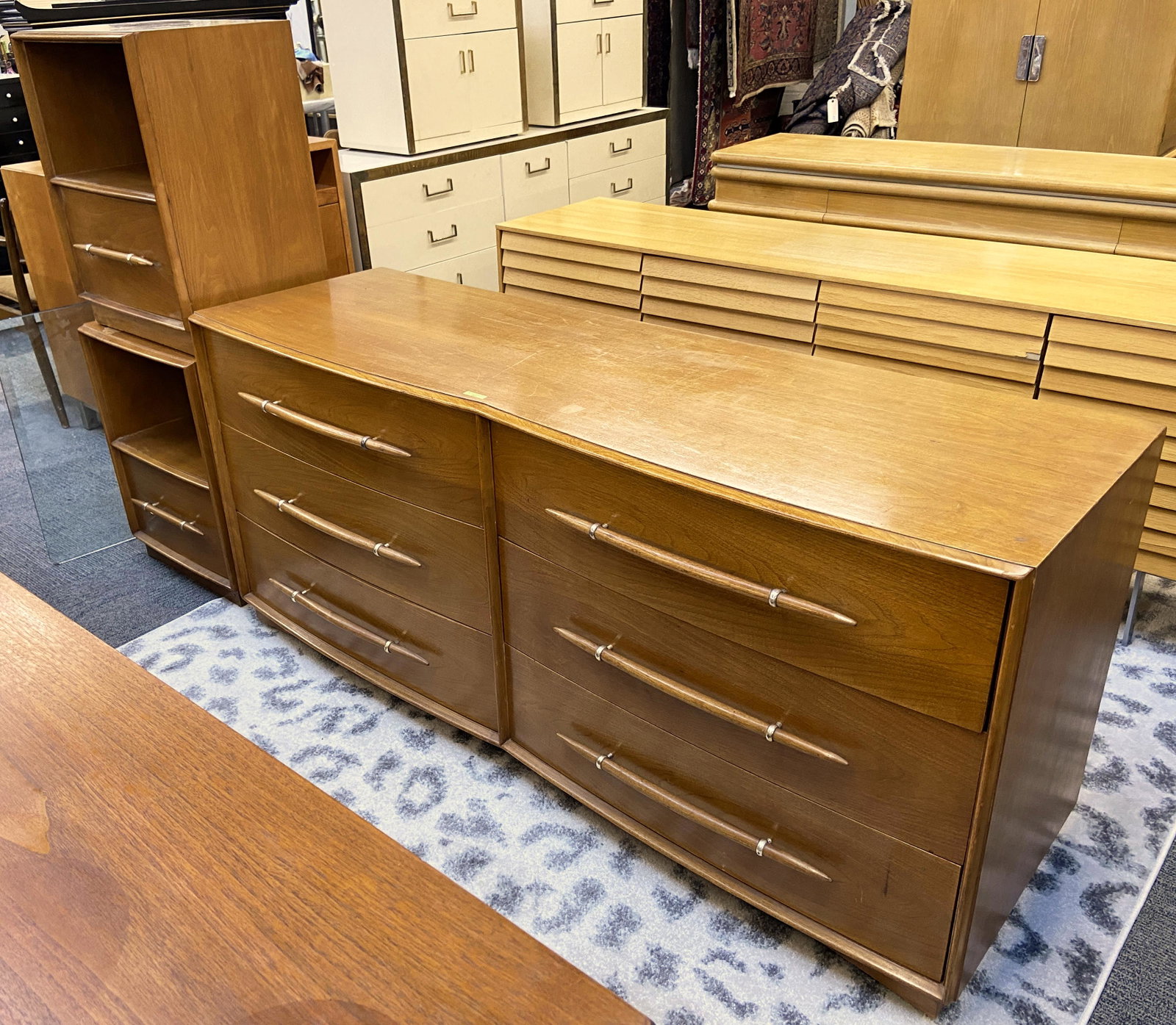 T.H. Robsjohn Gibbings for Widdicomb Bedroom Set.: Consists of a Dresser and Pair of Nightstands. The Nightstands have Damage to the Finish on the Tops of them. The Dresser Measures 67" Wide, 30" HIgh, and 21 1/4" Deep. The Dresser has Minor Wear. The