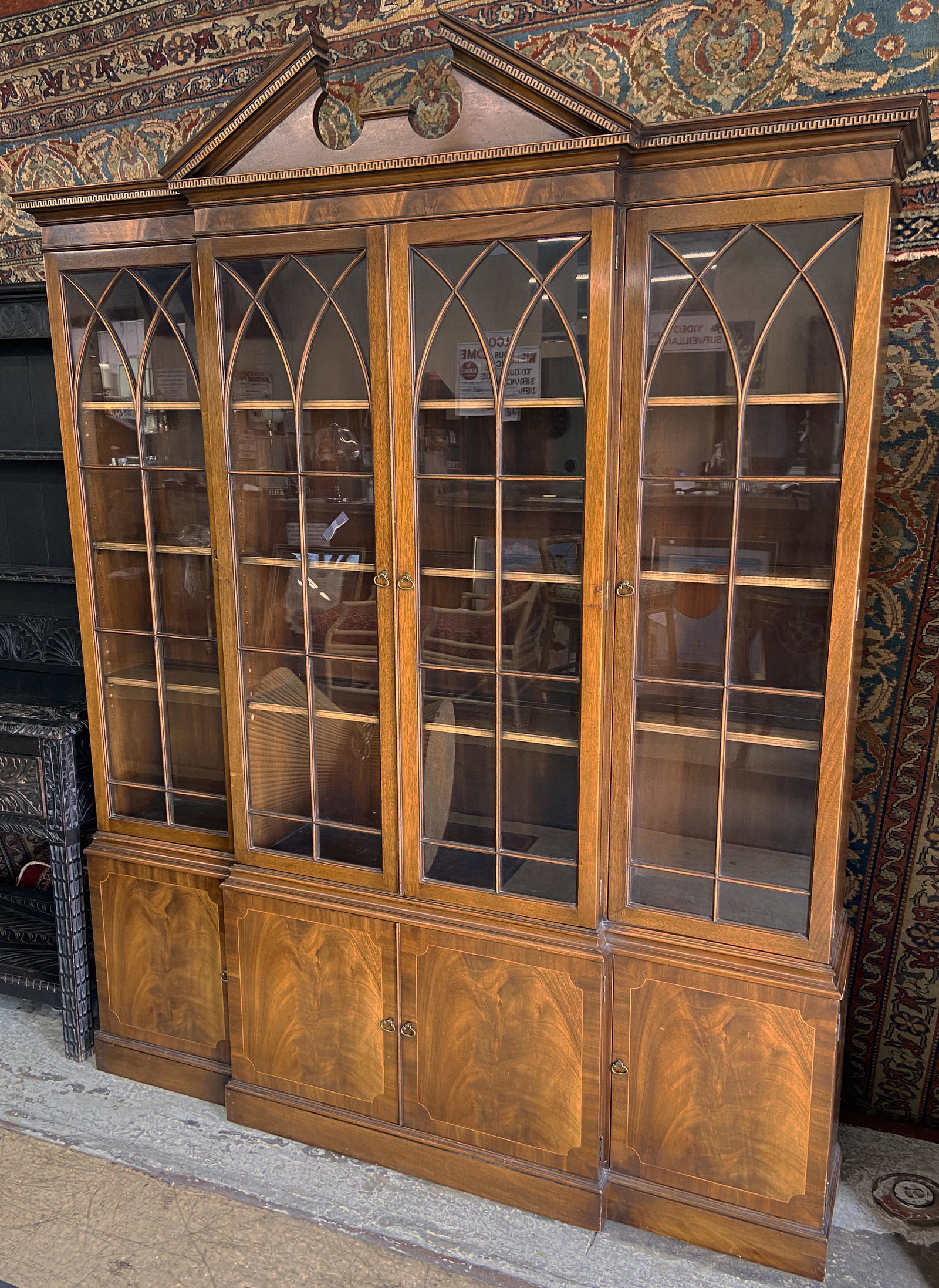 Chippendale-Style Traditional Breakfront.: Maker Unknown. The Piece has a Little Damage on the Right Hand Side, but is in Very Good Overall Condition. Measures 66" Wide and 86" High. Third-Party Freight Shipping or Personal Pickup Required.