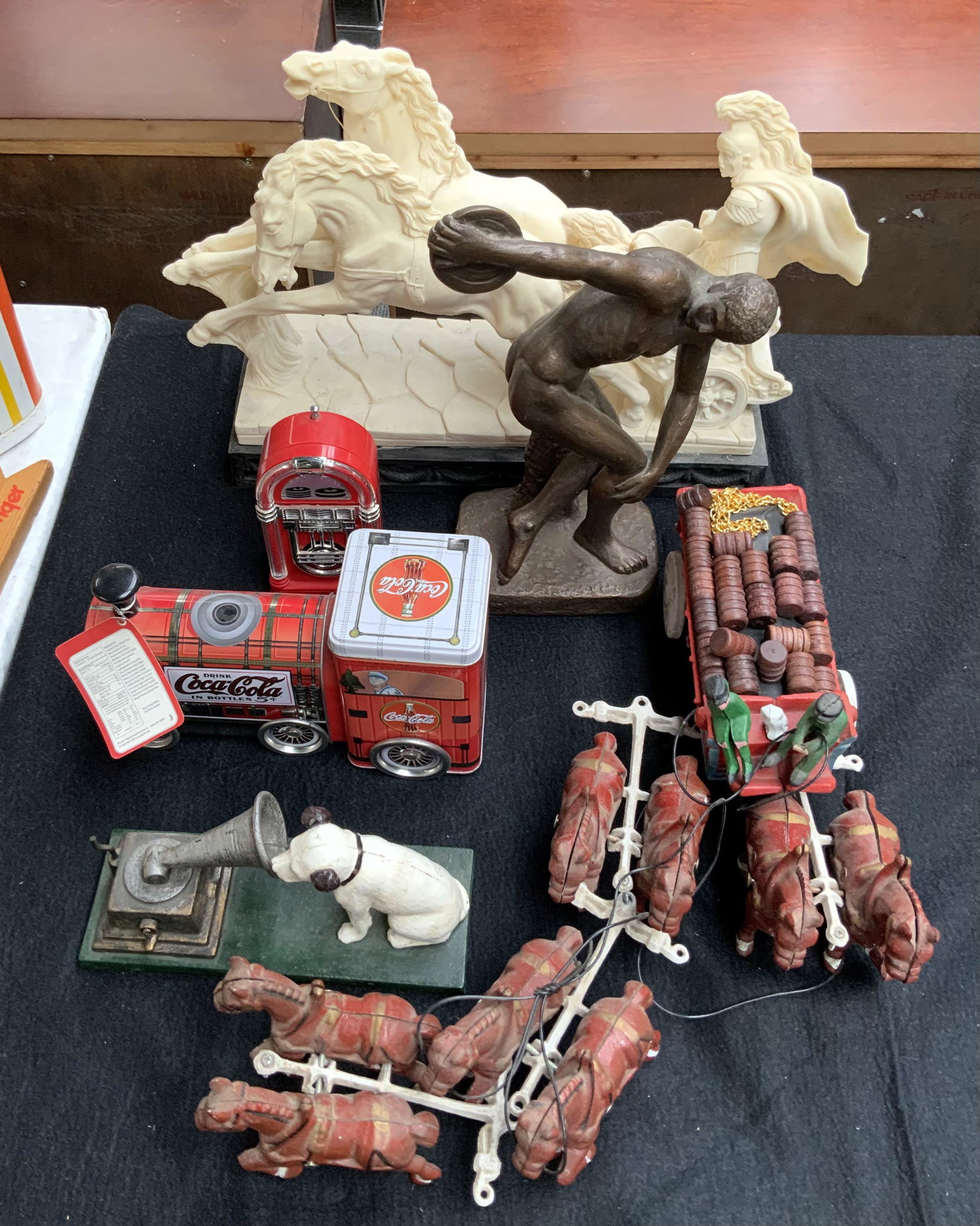 Lot of Assorted Items, inc. Santini-Like Sculpture: A Large Chariot Composition Sculpture (16" Wide, 14" Tall, 6" Deep), A Cast Iron Wagon with 8 Horses and Whiskey Barrels, a Cast Iron RCA Dog, a Coca-Cola Tin Cookie Train, and a Small Plastic Radio. 