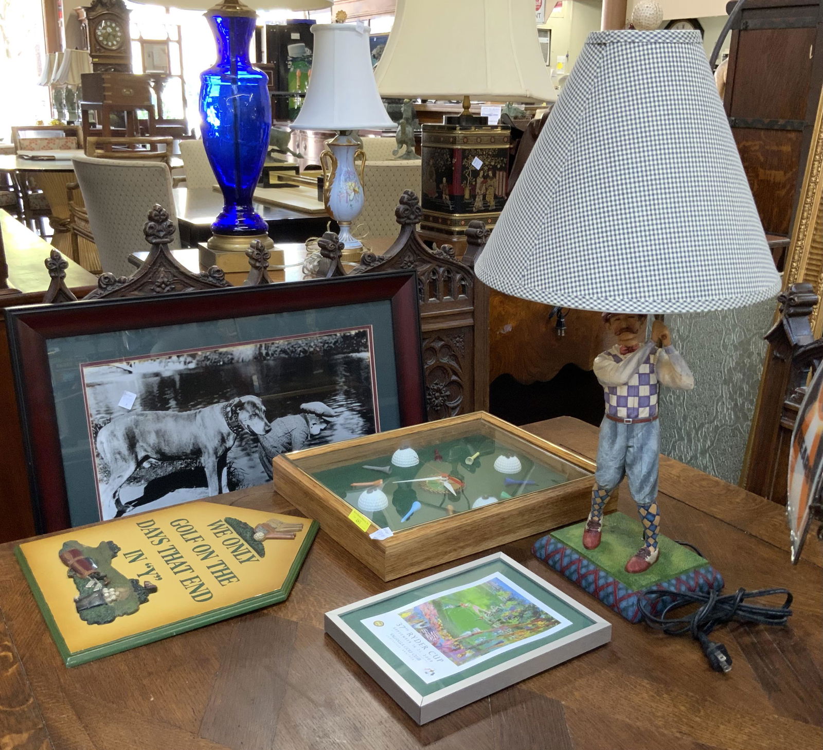 Lot of Assorted Golf & Golfing Memorabilia.: Includes a Golf Clock (15 1/2" Tall, 12" Wide, 2" Deep), a Golf Plaque, a 37th Ryder Cup (2008) Print, a 25" Tall Golfer Lamp, and a Child Golfing Framed Print. Third-Party Shipping or Personal Pickup
